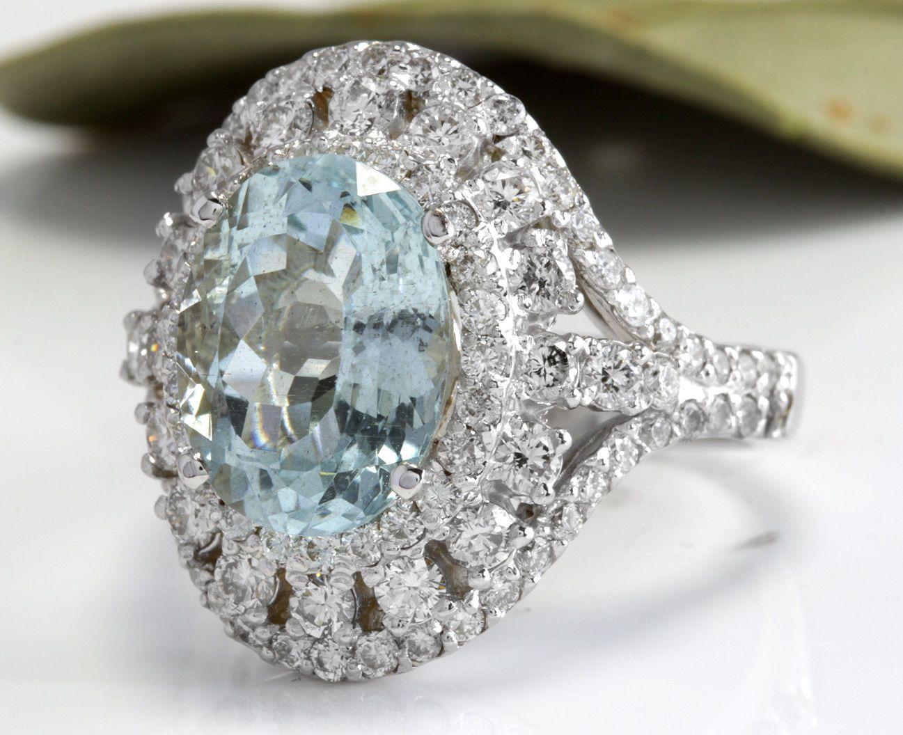 5.85 Carats Natural Aquamarine and Diamond 14K Solid White Gold Ring

Total Natural Oval Cut Aquamarine Weights: 3.60 Carats

Aquamarine Measures: 11.44 x 8.71mm

Natural Round Diamonds Weight: 2.25 Carats (color G / Clarity VS2-SI1)

Ring size: 7