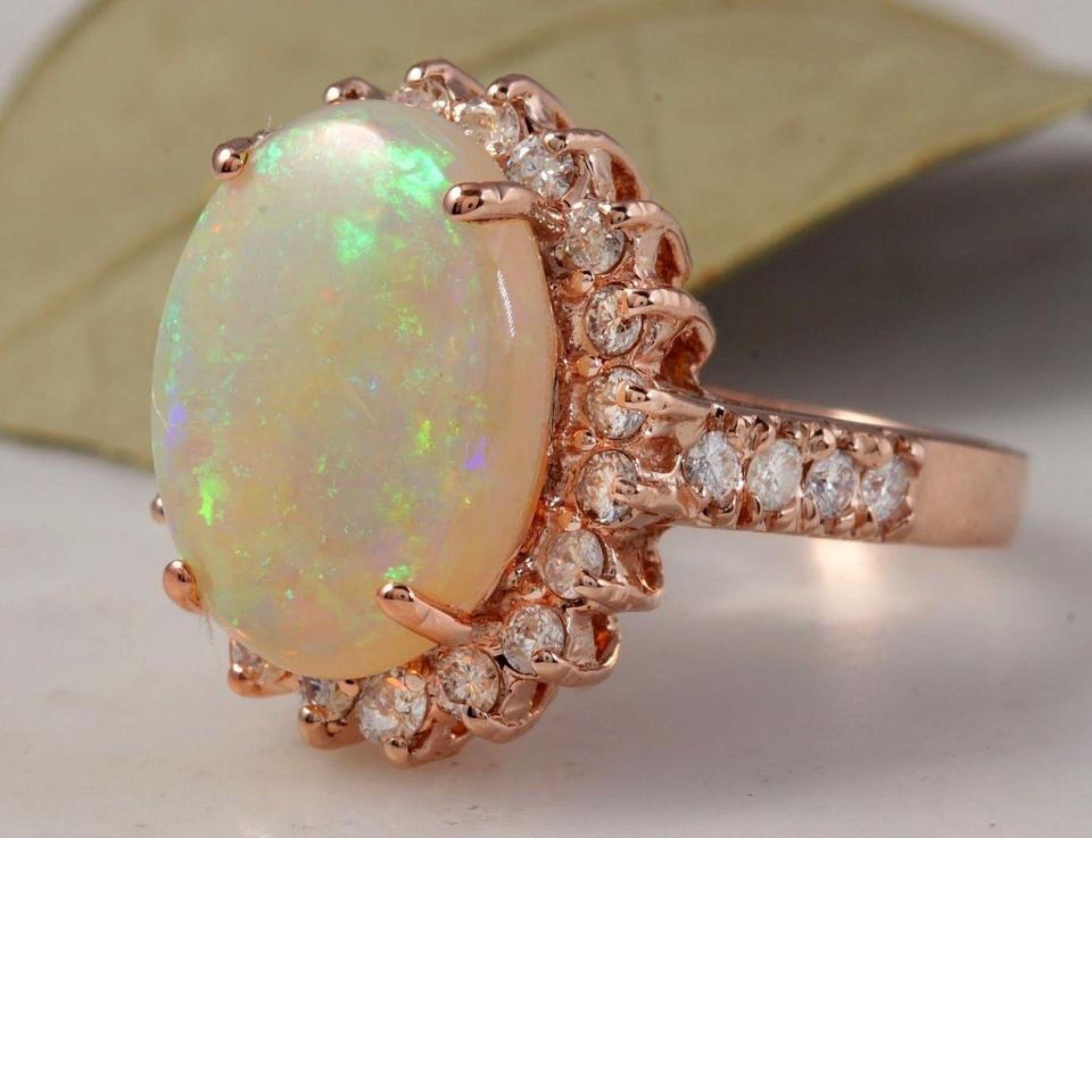 5.85 Carats Natural Impressive Australian Opal and Diamond 14K Solid Rose Gold Ring

Amazing play of colors opal. Pictures don't show the beauty of the opal.

Total Natural Opal Weight is: Approx. 5.00 Carats

Opal Measures: Approx. 14.00 x