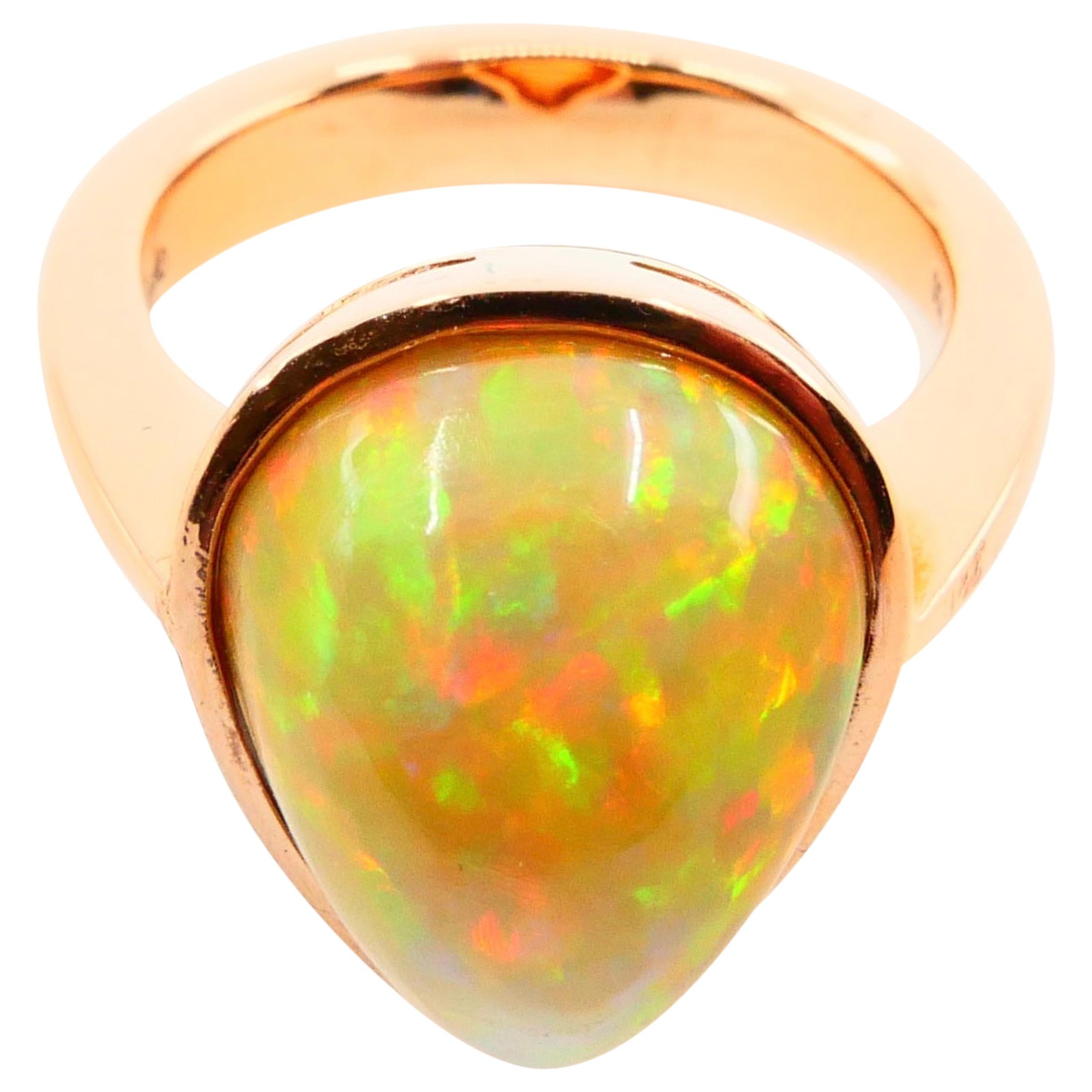 Pear Cut 5.85 Carat Opal Ring Set in 18 Karat Gold Colorful Red, Green, Orange and Yellow