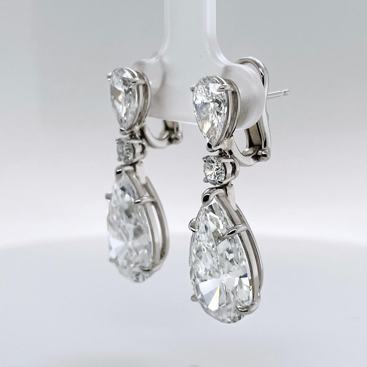 GIA certified Diamond Earrings, over 14.28 Carat total weight.
5.85 and 6.43 carat Pear Shaped Diamonds topped with Round diamonds and 1.00 carat Pear Shaped Diamonds

Accompanied by GIA reports:
5.85 Carat PS: GIA 2211602257 stating that the