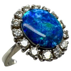 585 white gold ring with opal and sapphire