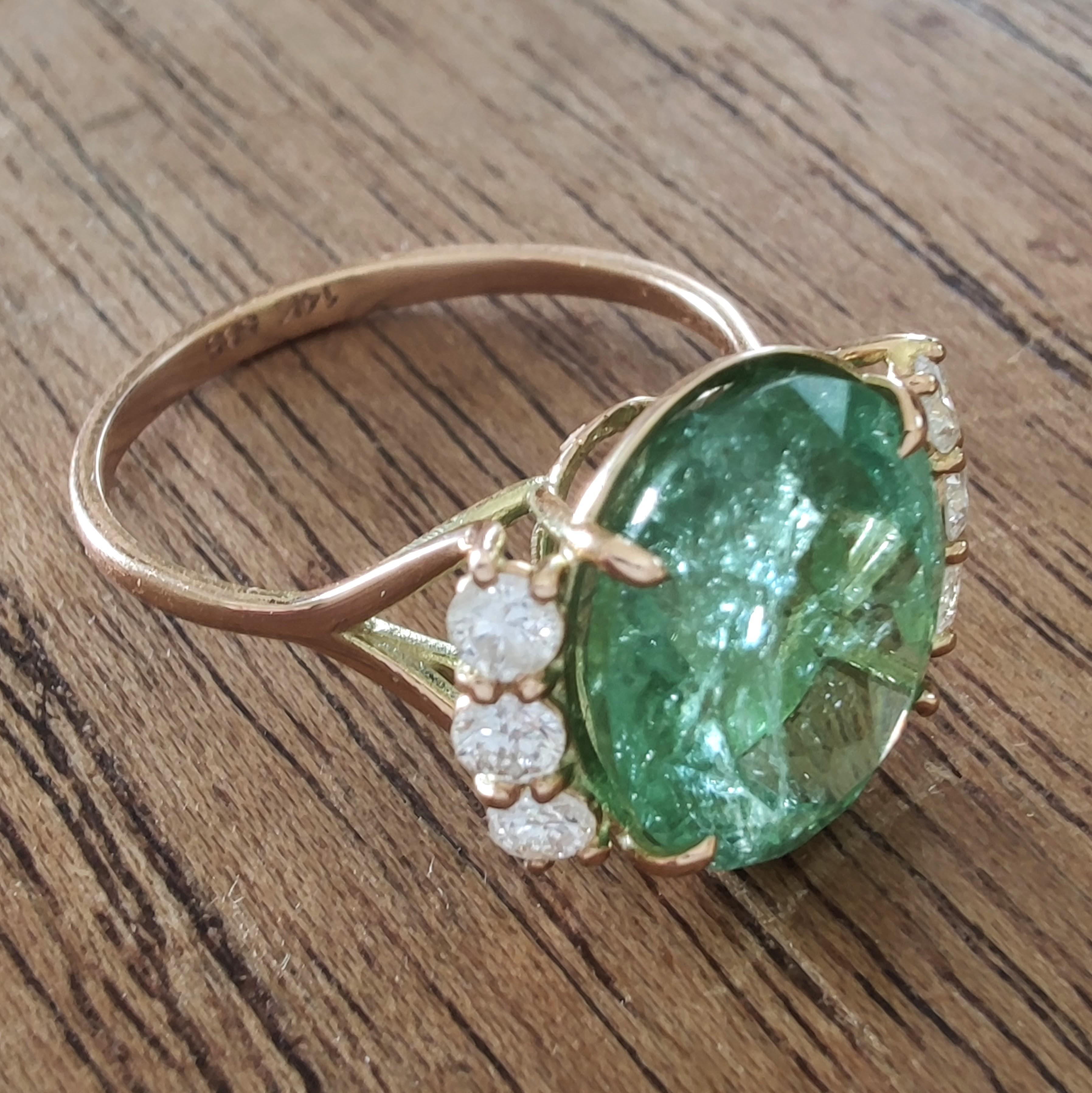 5.85ct Green Tourmaline and Diamond Cocktail Ring in 14K Yellow Gold – Handmade Statement Piece

Make a bold yet refined statement with this handmade cocktail ring featuring a vibrant green oval-cut tourmaline at its center. Set in 14-karat yellow