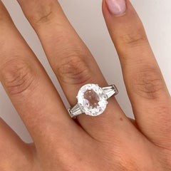 5.85ct Oval Faceted White Topaz Ring with Tapered Baguettes in 18ct White Gold