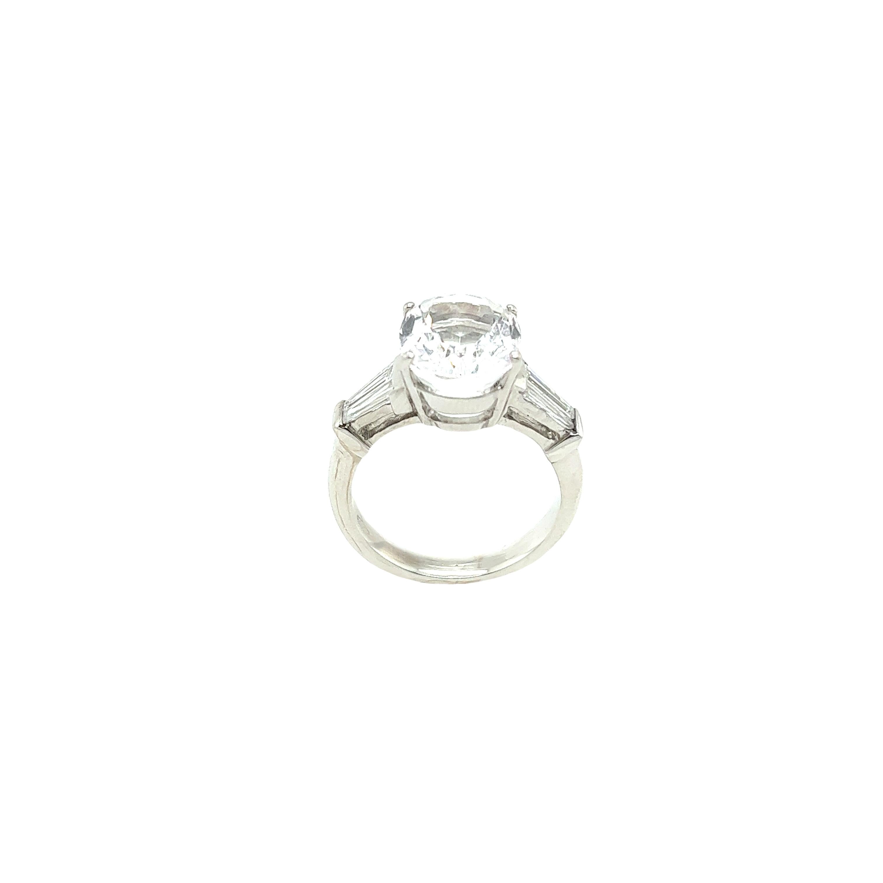 Baguette Cut 5.85ct Oval Faceted White Topaz Ring with Tapered Baguettes in 18ct White Gold For Sale