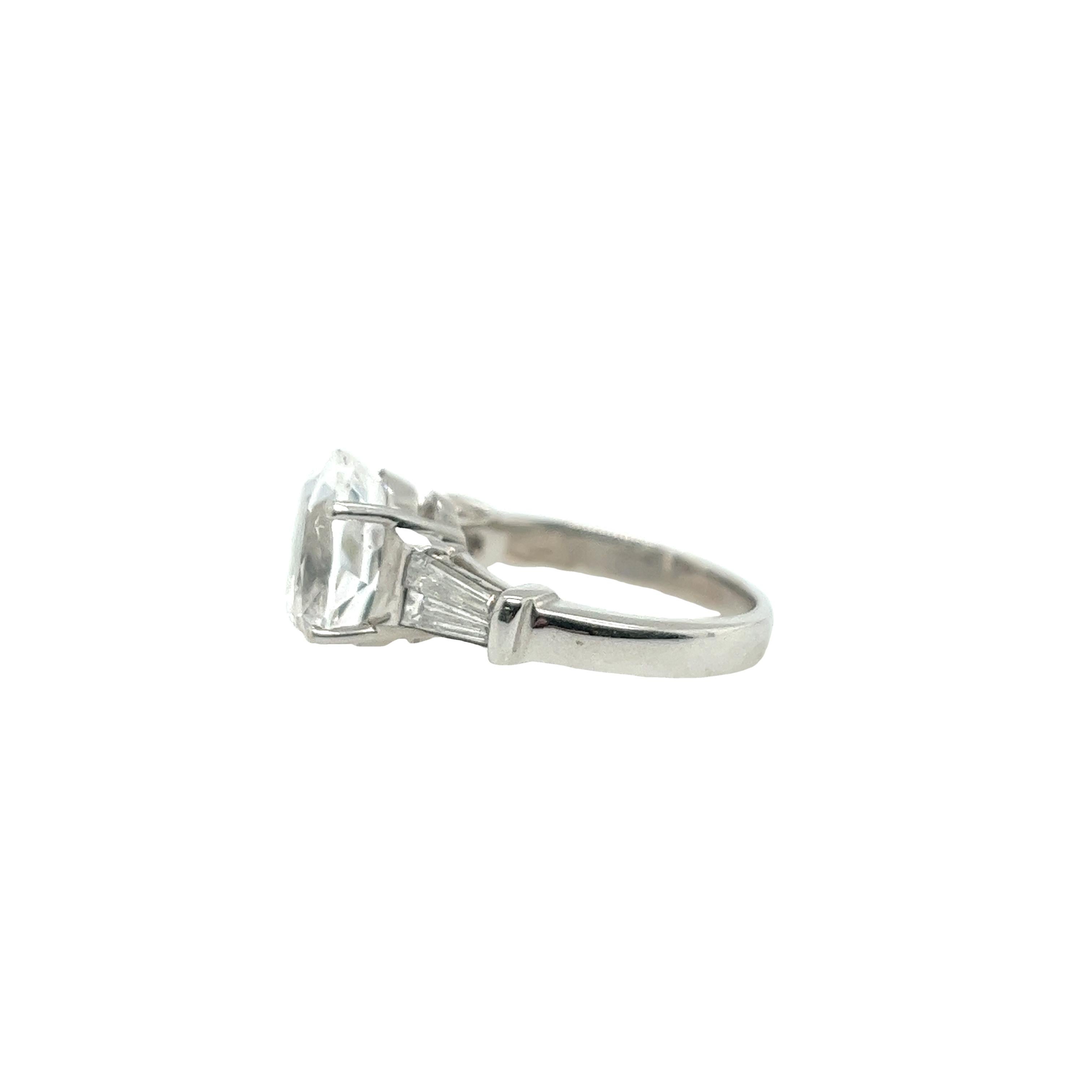 Women's 5.85ct Oval Faceted White Topaz Ring with Tapered Baguettes in 18ct White Gold For Sale