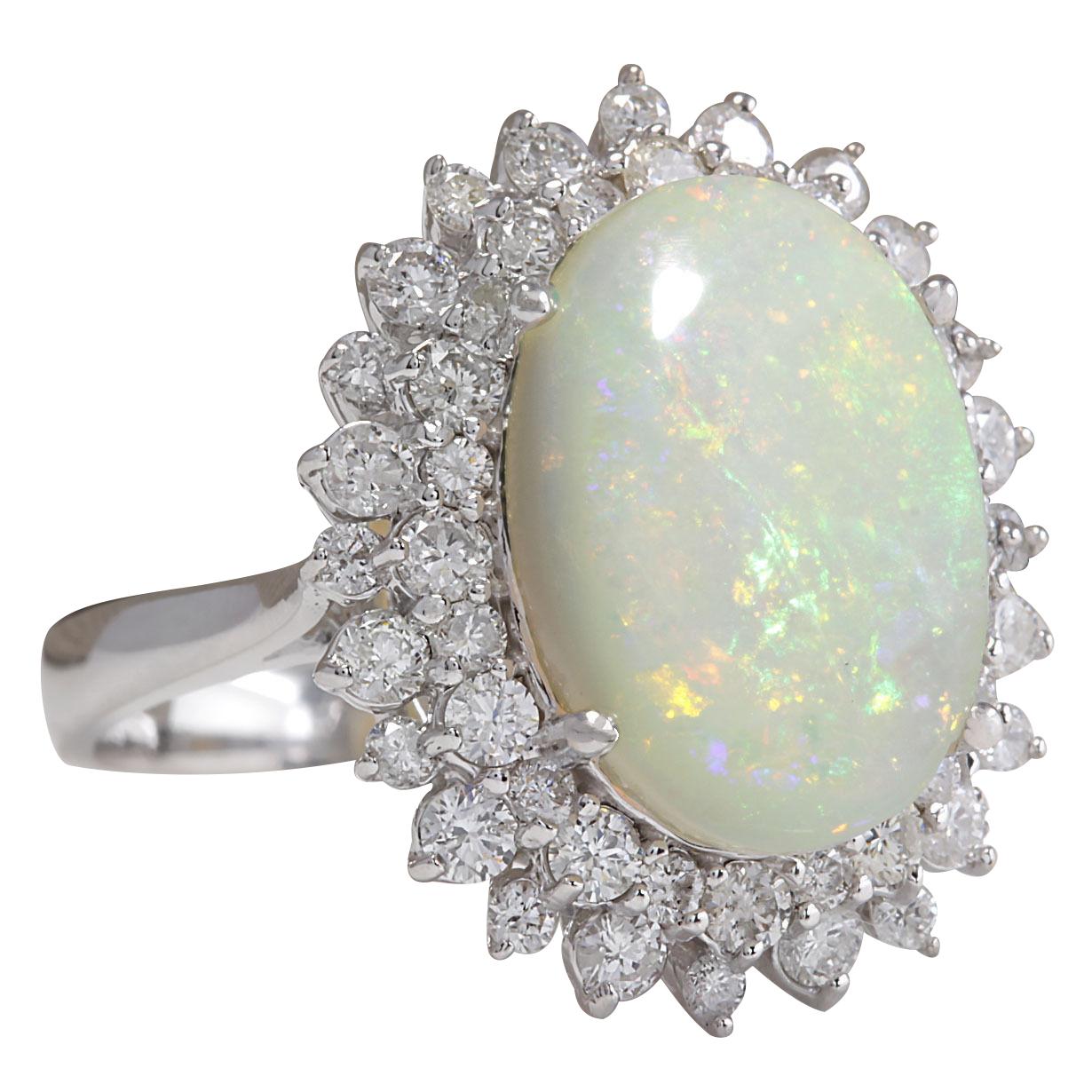 5.86 Carat Natural Opal 14 Karat White Gold Diamond Ring
Stamped: 14K White Gold
Total Ring Weight: 5.8 Grams
Total Natural Opal Weight is 4.36 Carat (Measures: 16.00x12.00 mm)
Color: Multicolor
Total Natural Diamond Weight is 1.50 Carat
Color: F-G,