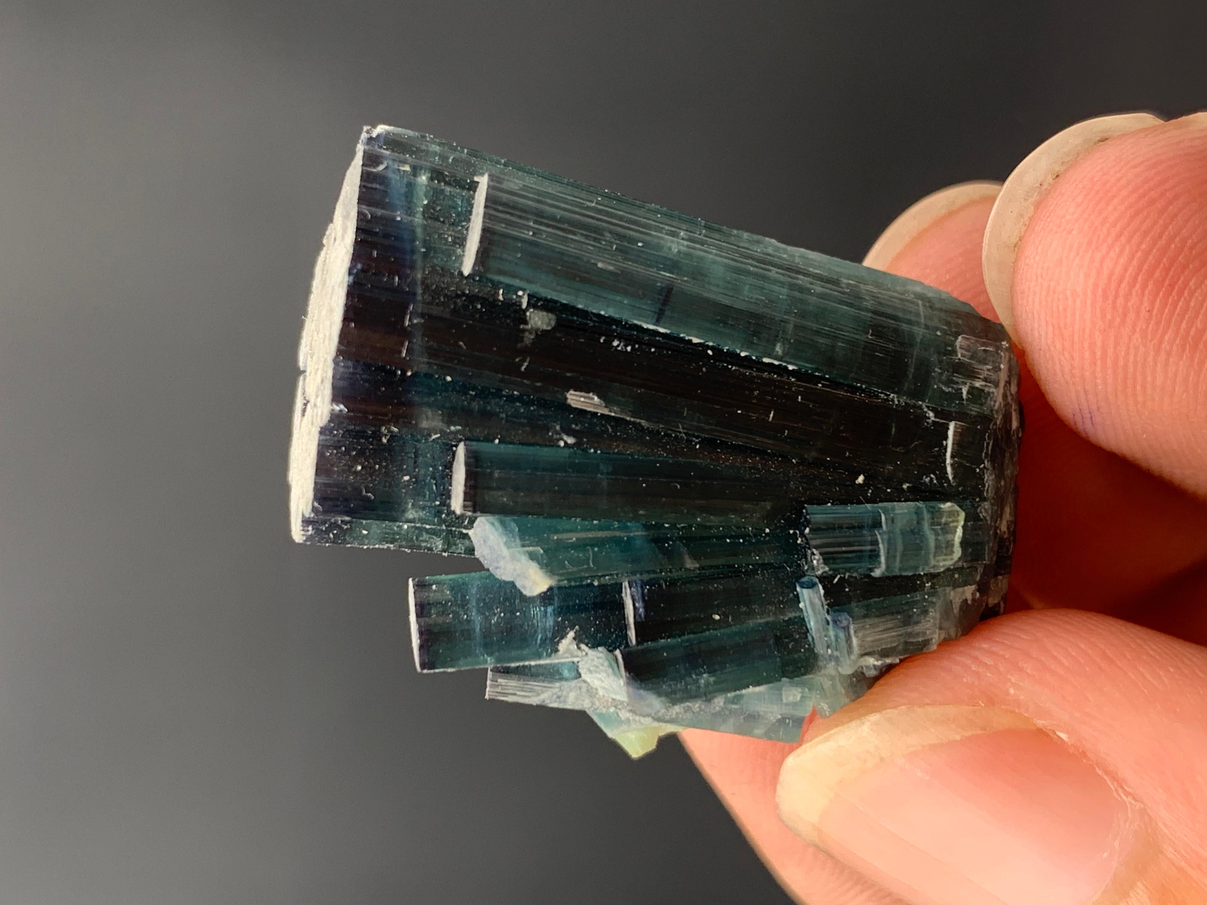 58.60 Carat Gorgeous Indicolite Blue Color Tourmaline Cluster From Afghanistan 
Weight: 58.60 Carat 
Dimension: 3 x 2.2 x 1 Cm
Origin: Kunar, Afghanistan 

Tourmaline is a crystalline silicate mineral group in which boron is compounded with elements