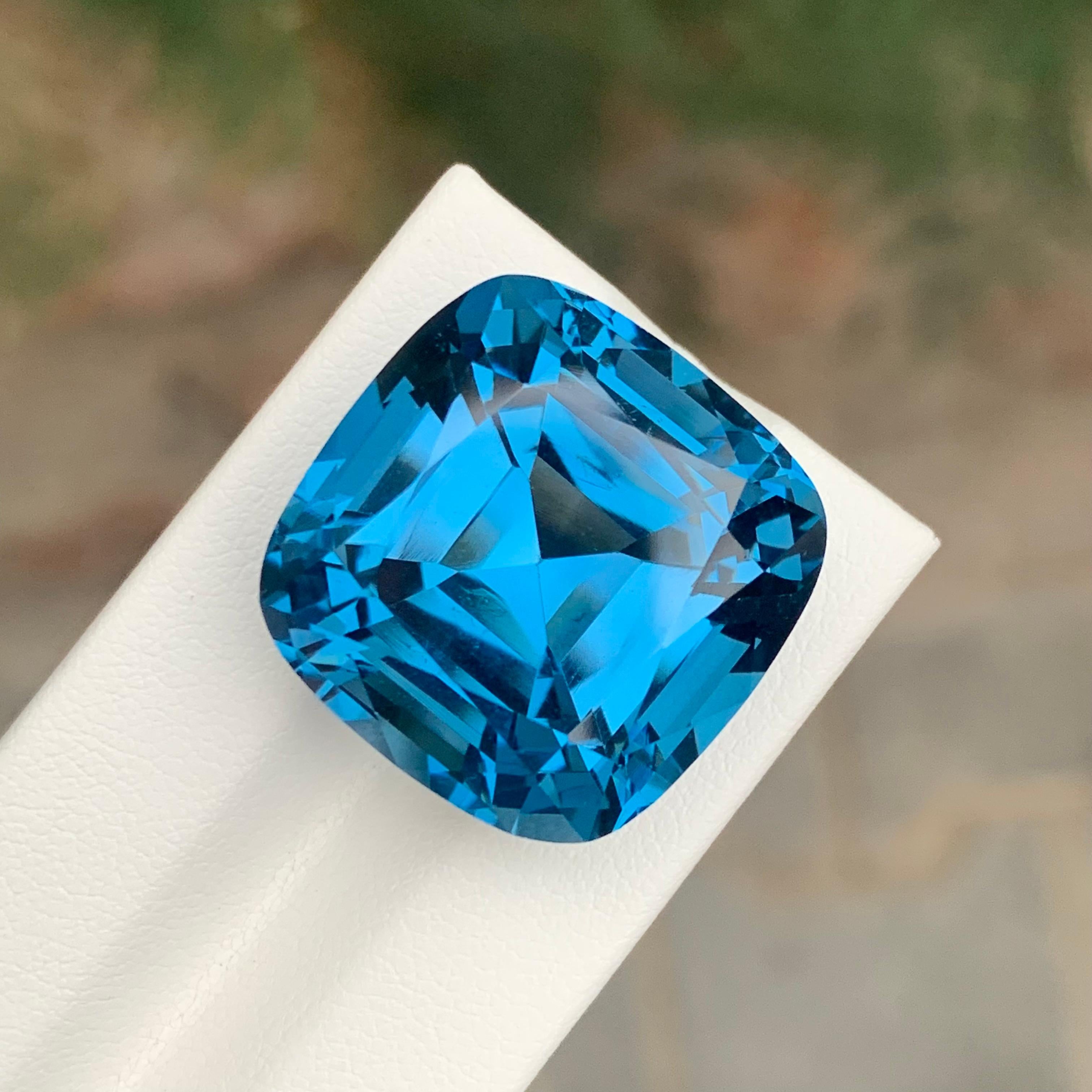 Loose London Blue Topaz

Weight: 58.65 Carats
Dimension: 21 x 21 x 15.5 Mm
Origin: Brazil
Shape: Square Cushion
Color: Deep Blue
Certificate: On Customer Demand

London Blue Topaz is a mesmerizing variety of topaz renowned for its deep and