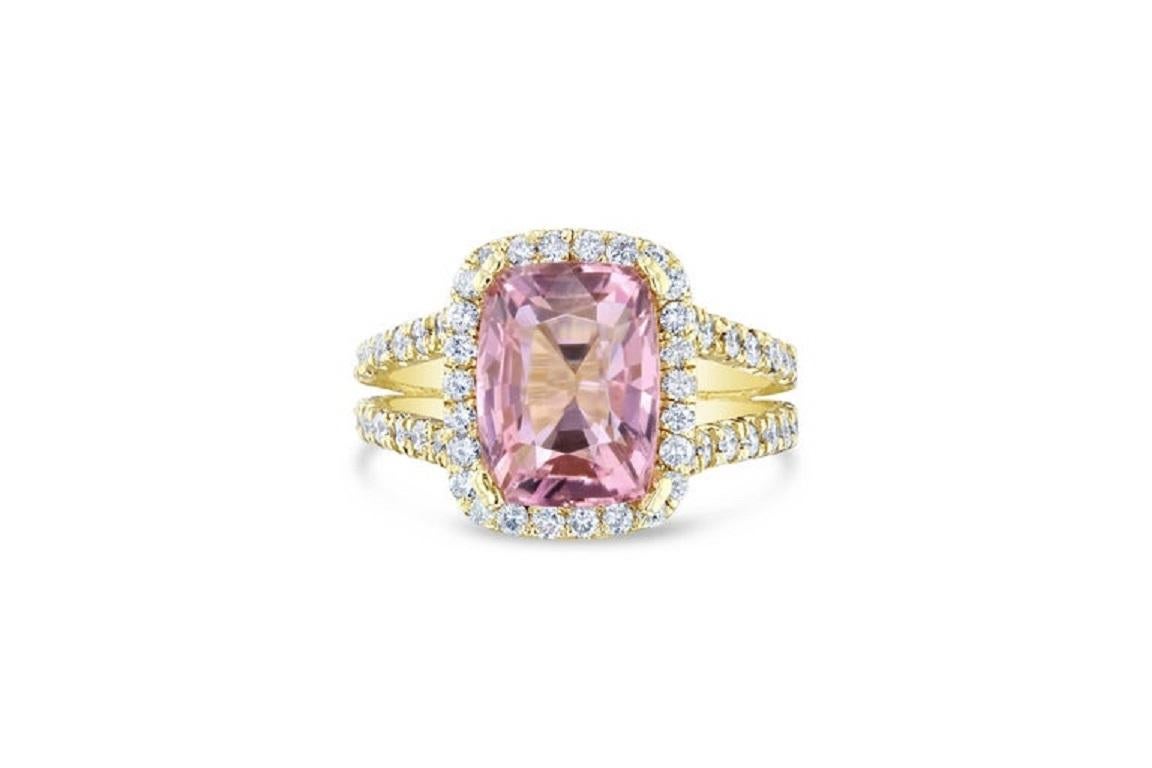 This ring has a 4.46 carat Emerald-Cushion Cut Tourmaline in the center of the ring and is surrounded by 94 Round Cut Diamonds that weigh 1.41 carats. The clarity and color is VS2/H.  The total carat weight of the ring is 5.87 carats.

It is crafted