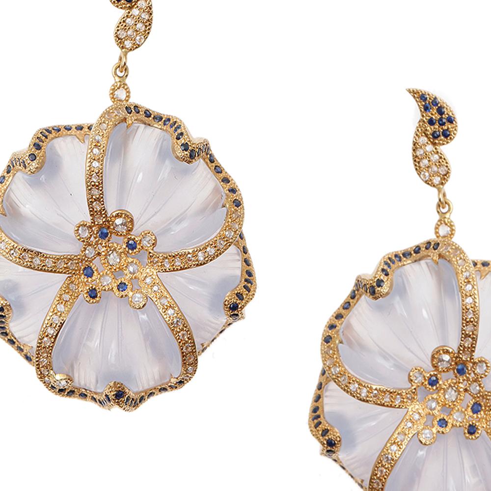 Chalcedony Drop Earrings set in 20 Karat Yellow Gold with 58.72-carat Carved Chalcedony, 1.87-carat Sapphire, and 1.27-carat Diamonds. These earrings have been designed from the affinity collection which is inspired by Earth's cultures and its