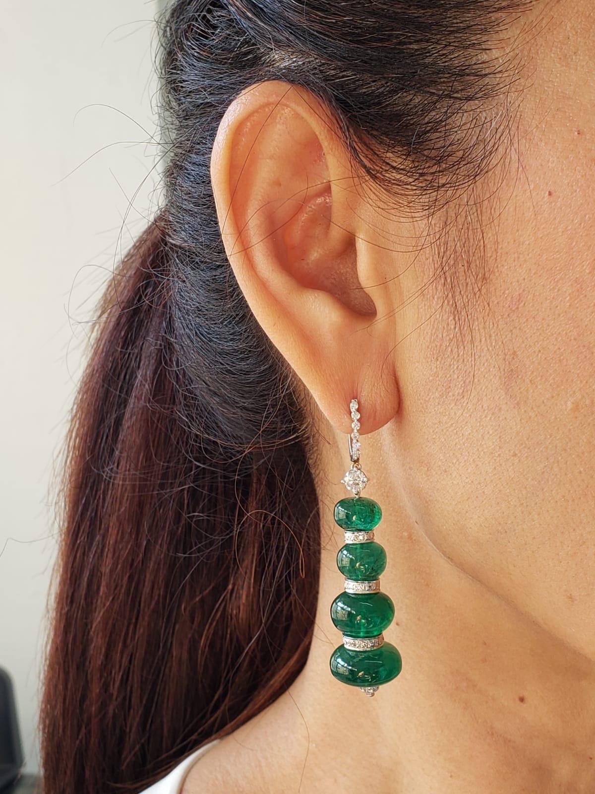 A pair of 58.72 carat Zambian Emerald beads earrings, transparent with few natural inclusions. These are a classic piece, with a modern touch - the quality of the emeralds speaks for itself! The emerald beads are absoluately natural, with no