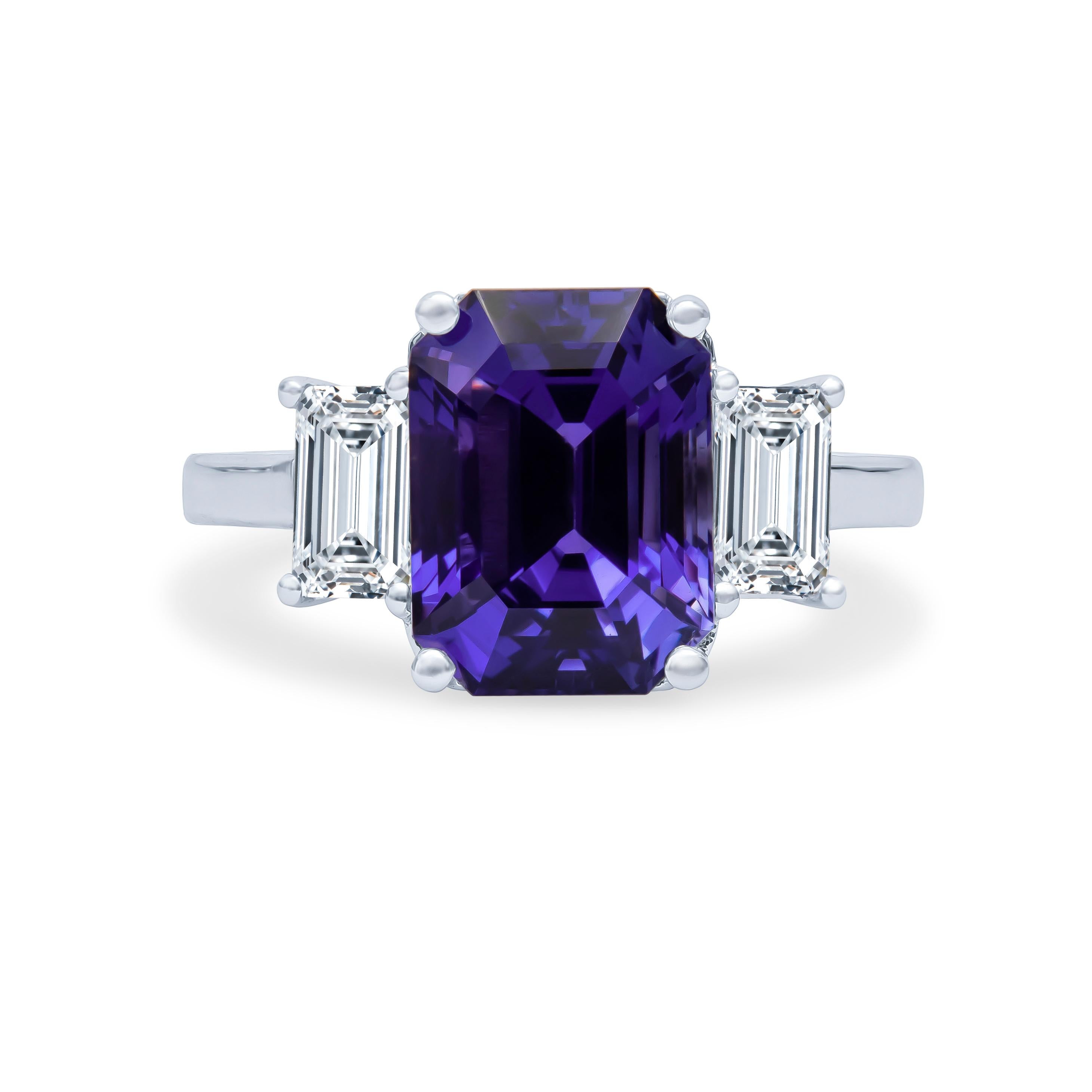 5.87 Carat total natural violetish blue and pinkish purple color-change sapphire, no-heat Sri Lanka origin (AGL report), set in a platinum 3-stone ring with two emerald cut natural diamonds weighing 0.98 carats total (GIA Reports - H VS1 & I VS2).