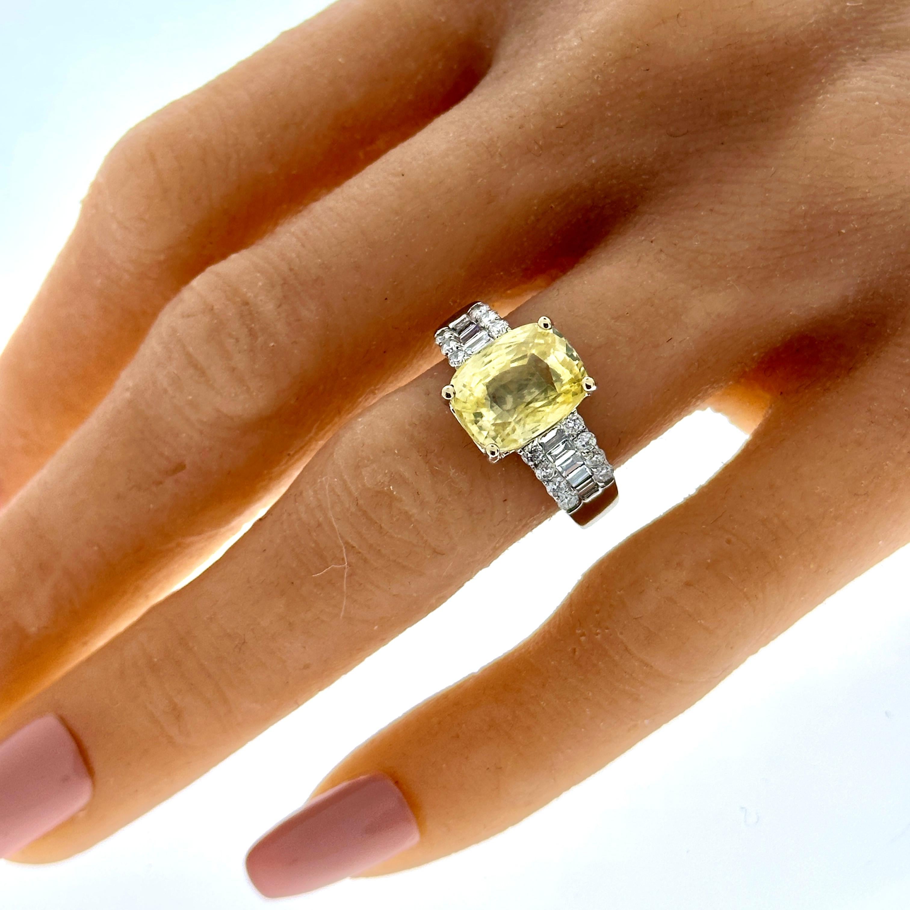 This cocktail halo ring is dripping with vibrancy and scintillation. An 5.87 carat square cushion cut, natural vivid yellow sapphire is obviously notable. The gem source is Sri Lanka; its transparency and luster are excellent. Its color is evenly