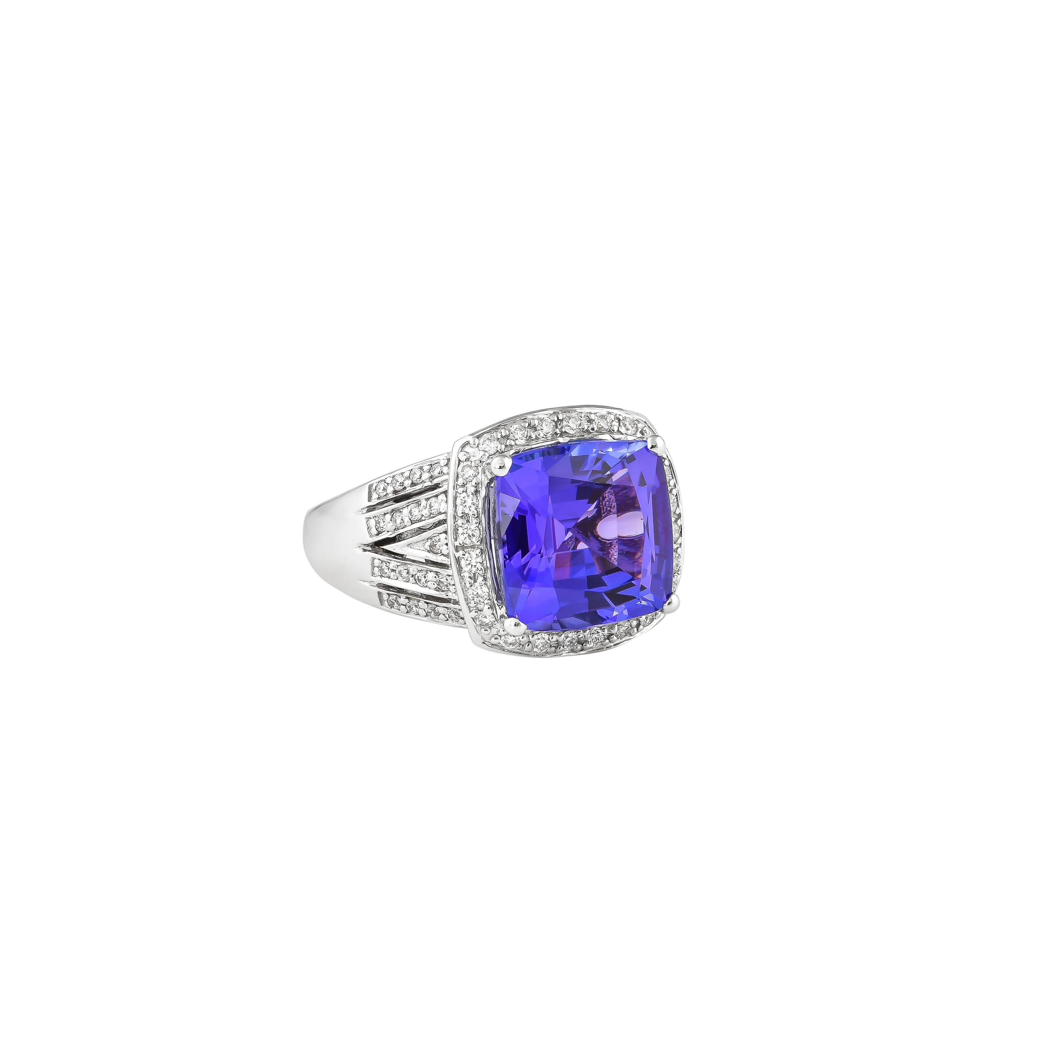 Classic tanzanite ring in 18K white gold with diamonds. 

Tanzanite: 5.88 carat cushion shape.
Diamonds: 0.31 carat, G color, VS clarity. 

Gold: 8.921g, 18K white gold. 