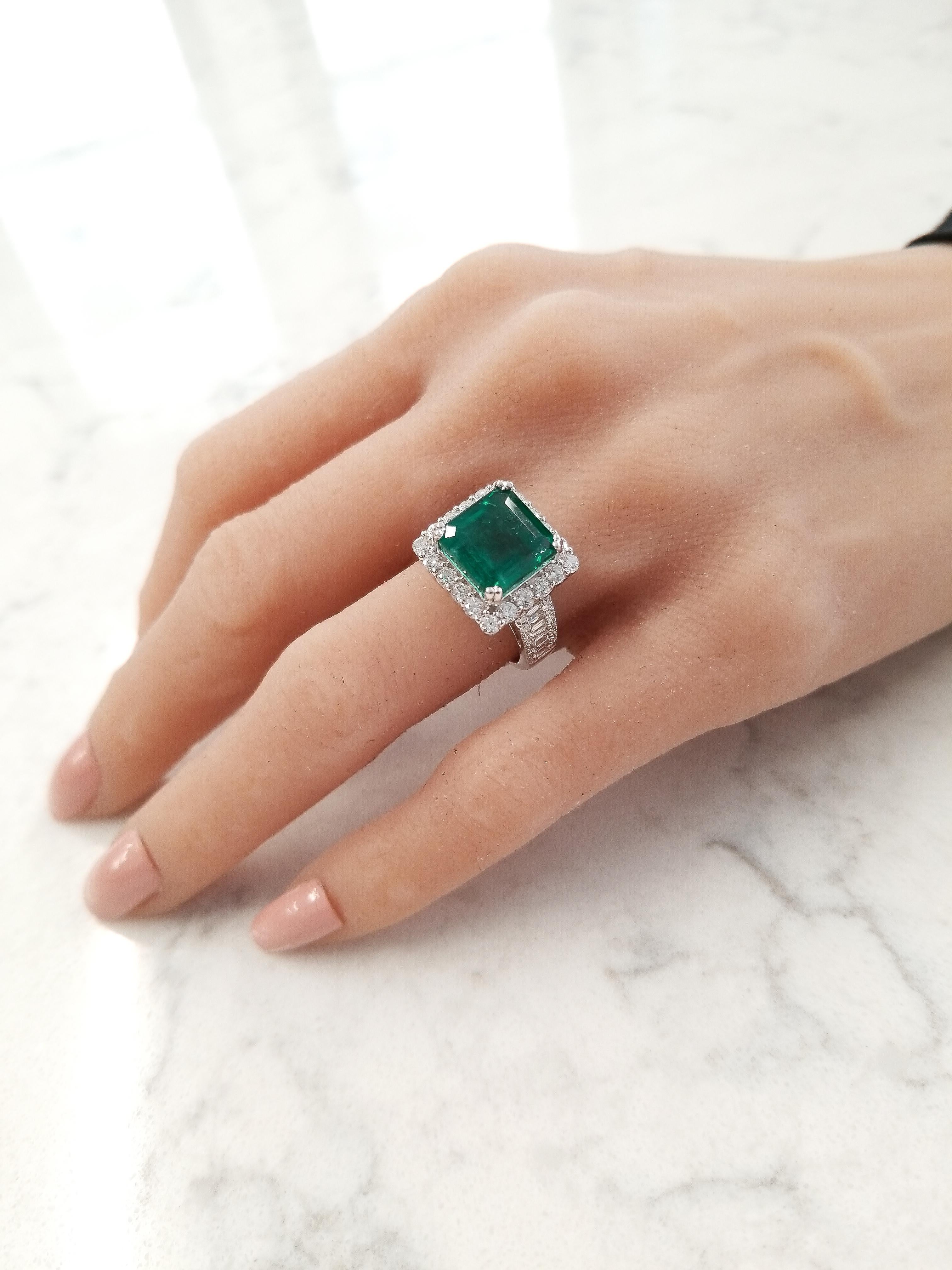 This cocktail ring features a 5.88 carat square emerald cut, vibrant grass-green emerald with measurements of 10.15 X 10.46mm. This emerald exhibits a lively, bright green shade. The gem source is Colombia. Its color, luster, clarity, and