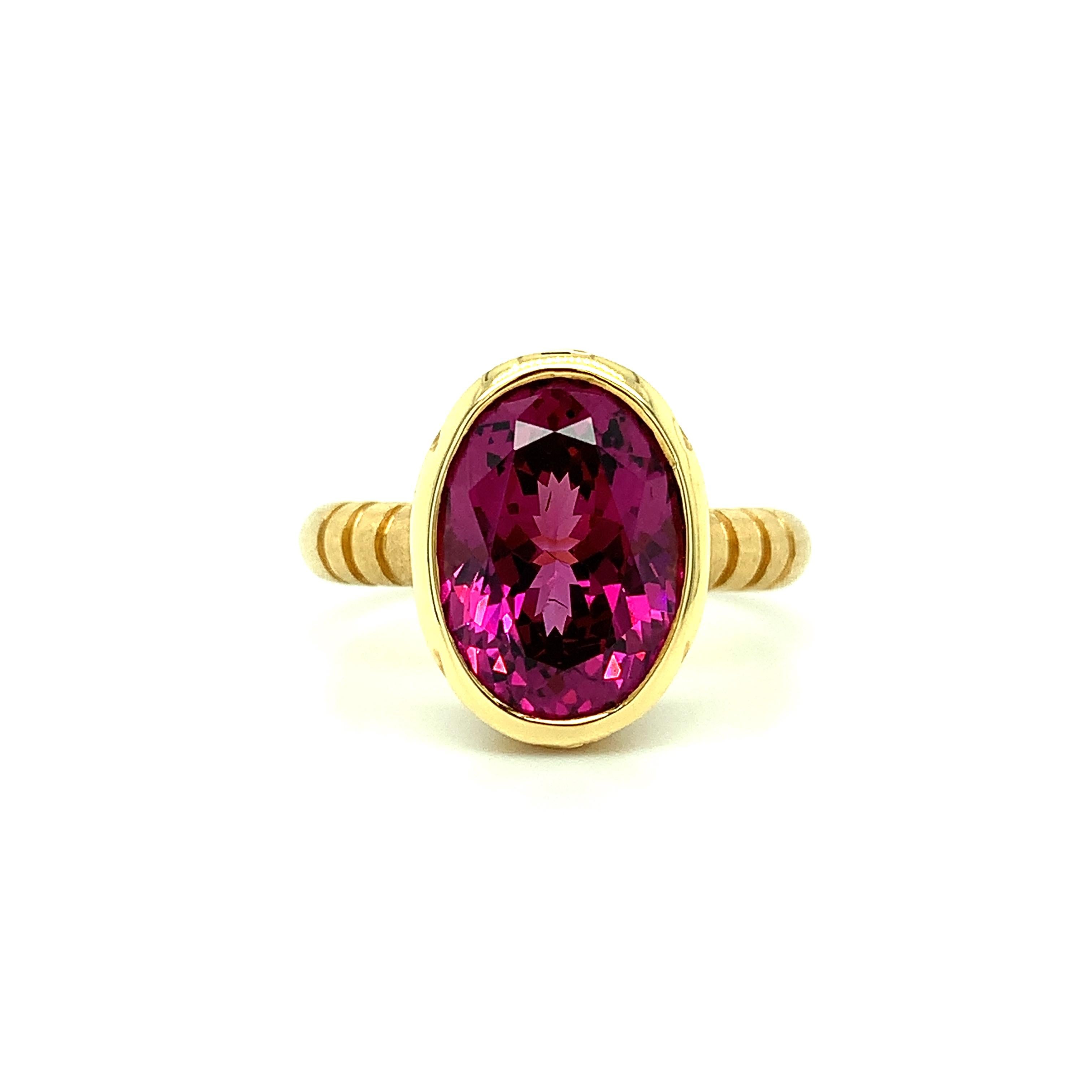 This lovely Byzantine-inspired ring features a luscious 5.88 carat pinkish-purple rhodolite garnet with exceptional color and brilliance. Bezel-set in a handmade, 18k yellow gold ring, this gorgeous rhodolite exhibits brilliant pink and purple hues
