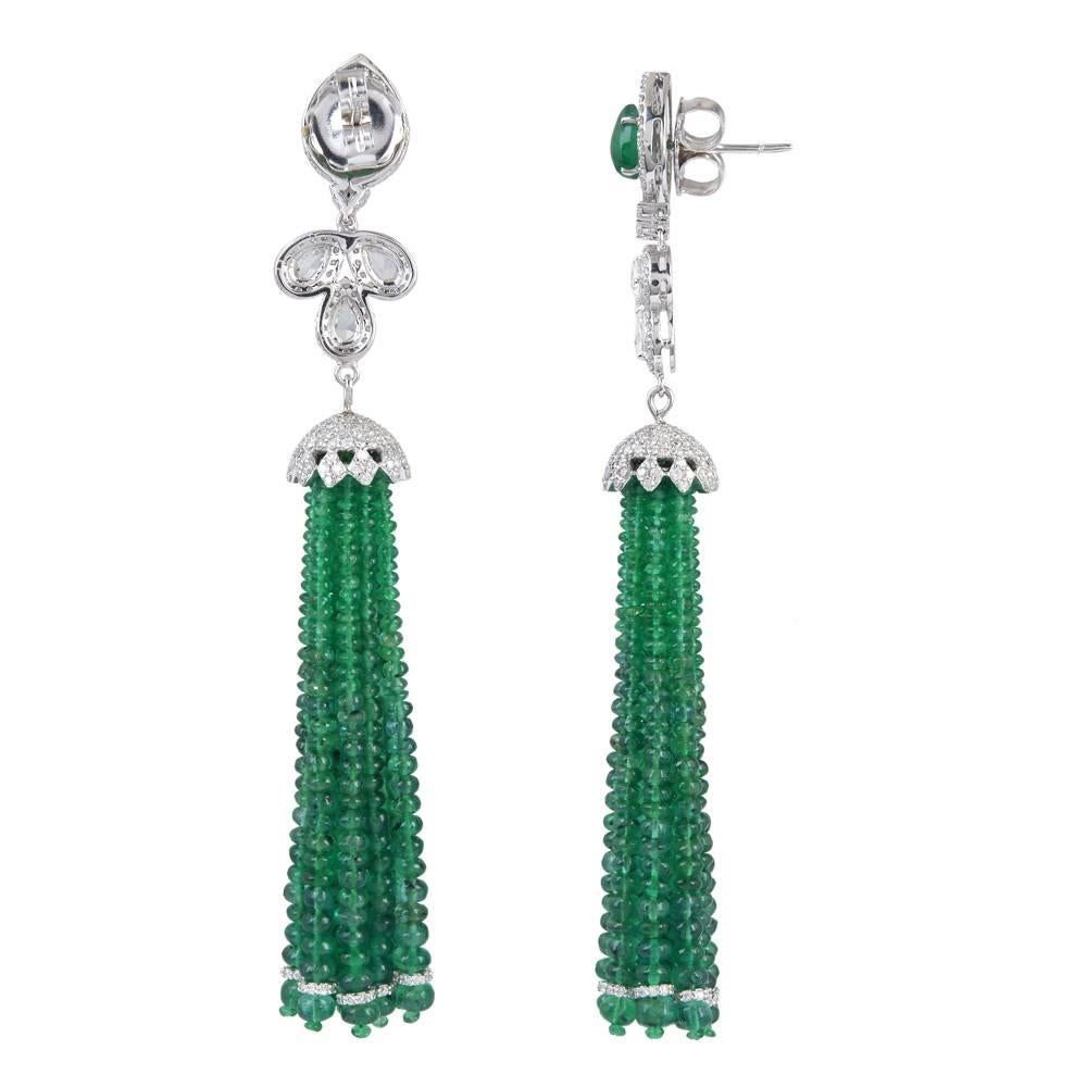 This royal looking 18K Gold Tassel Earring with Diamonds and Emerald is simply classic. This has full cut round pave set diamonds and pear shape rose cut diamonds making a leaf shape. 
Closure: Push Post
Diamonds: 3.73cts
Emerald: 58.85cts