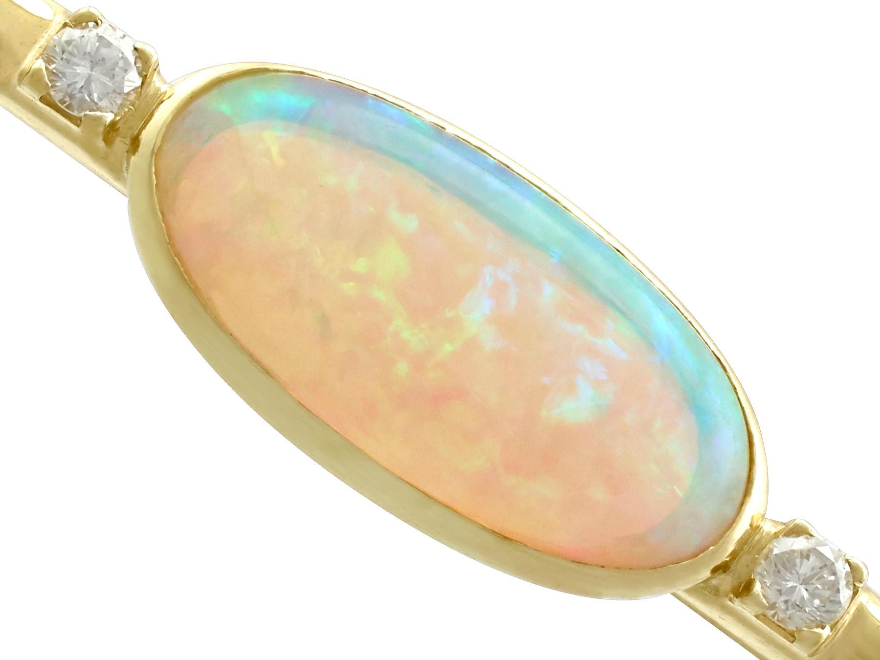 An impressive vintage 5.89 carat opal, 0.28 carat diamond and 18 karat yellow gold bar brooch; part of our diverse vintage estate jewelry collections

This fine and impressive vintage opal bar brooch has been crafted in 18 k yellow gold.

The brooch