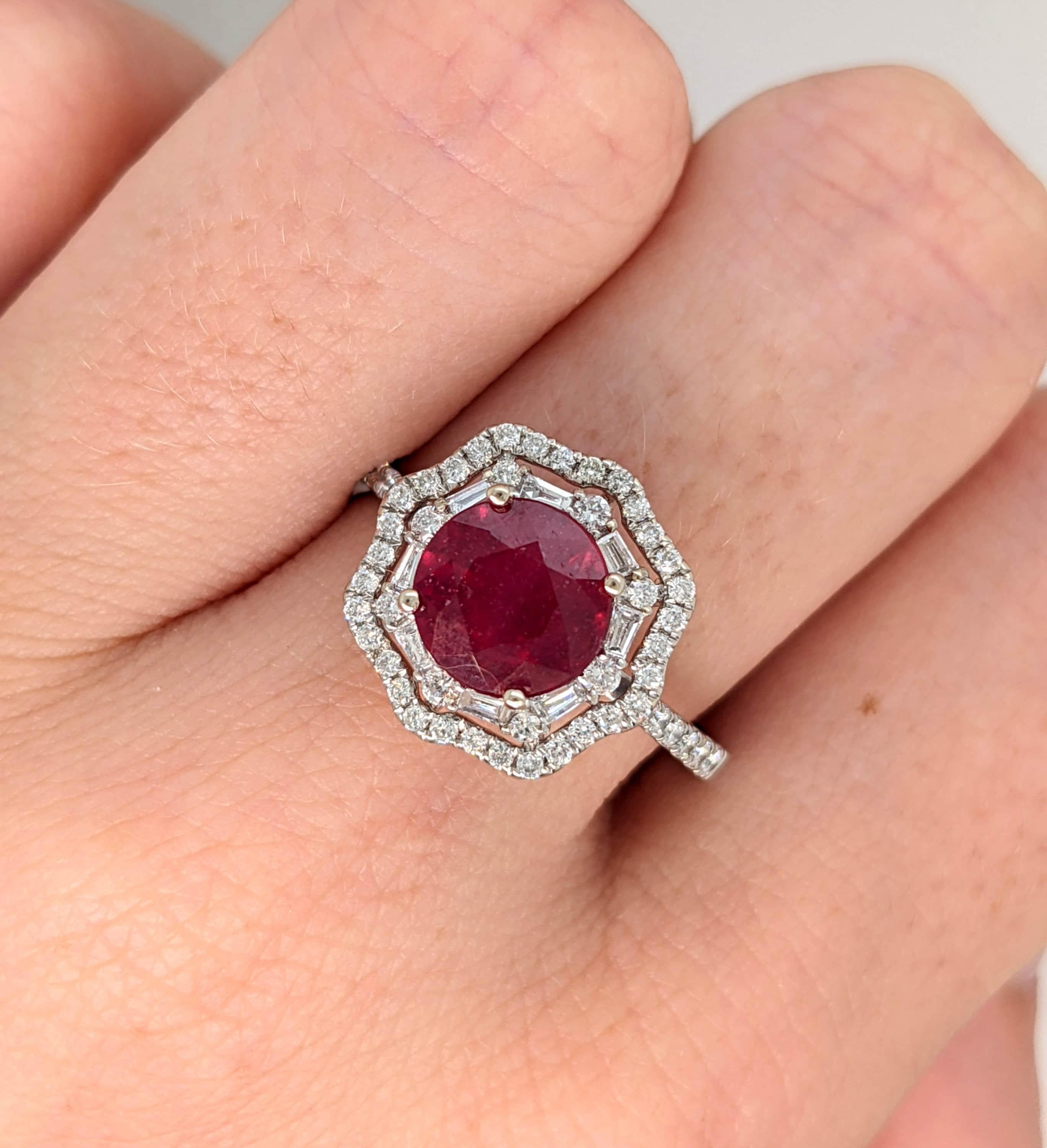 This beautiful ring features a 5.8 carat round ruby gemstone with a double halo of natural earth mined diamonds and a diamond studded shank, all set in solid 14K gold. This ring makes a lovely July birthstone gift for your loved ones!

**We offer