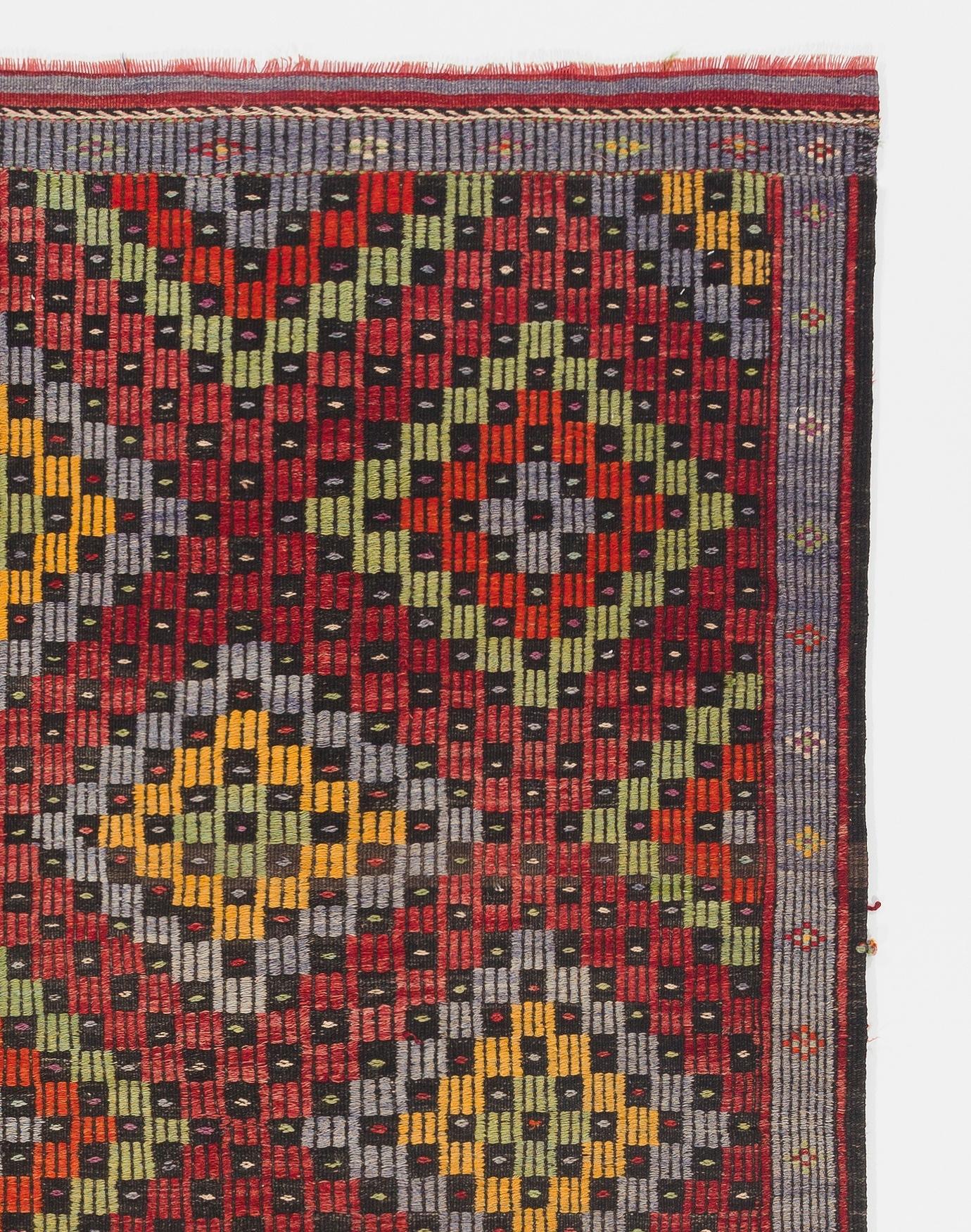 This attractive flat-weave rug is handwoven in fine local wool to create a sturdy floor covering. This type of Kilims (woven in the intricate 