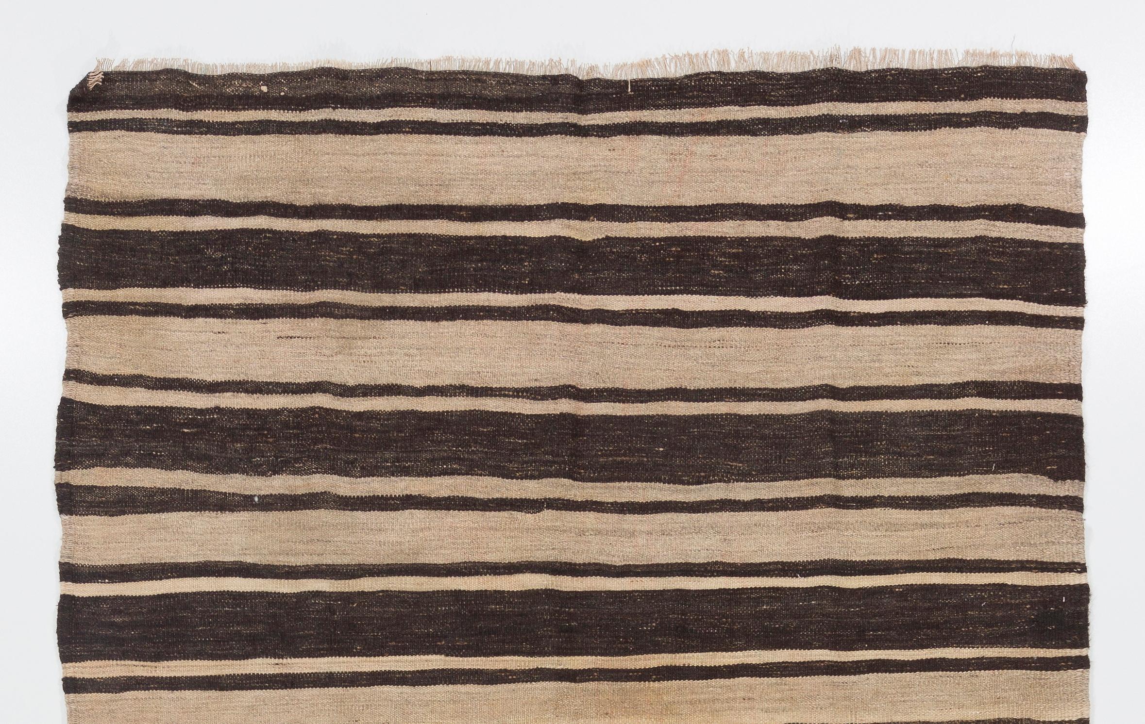 This simple handwoven rug made to be used by the villagers in Central Anatolia. 100% natural undyed wool. Good condition and cleaned professionally.
We can modify the dimensions if requested, i.e. make it shorter and/or narrower. Mreasures: