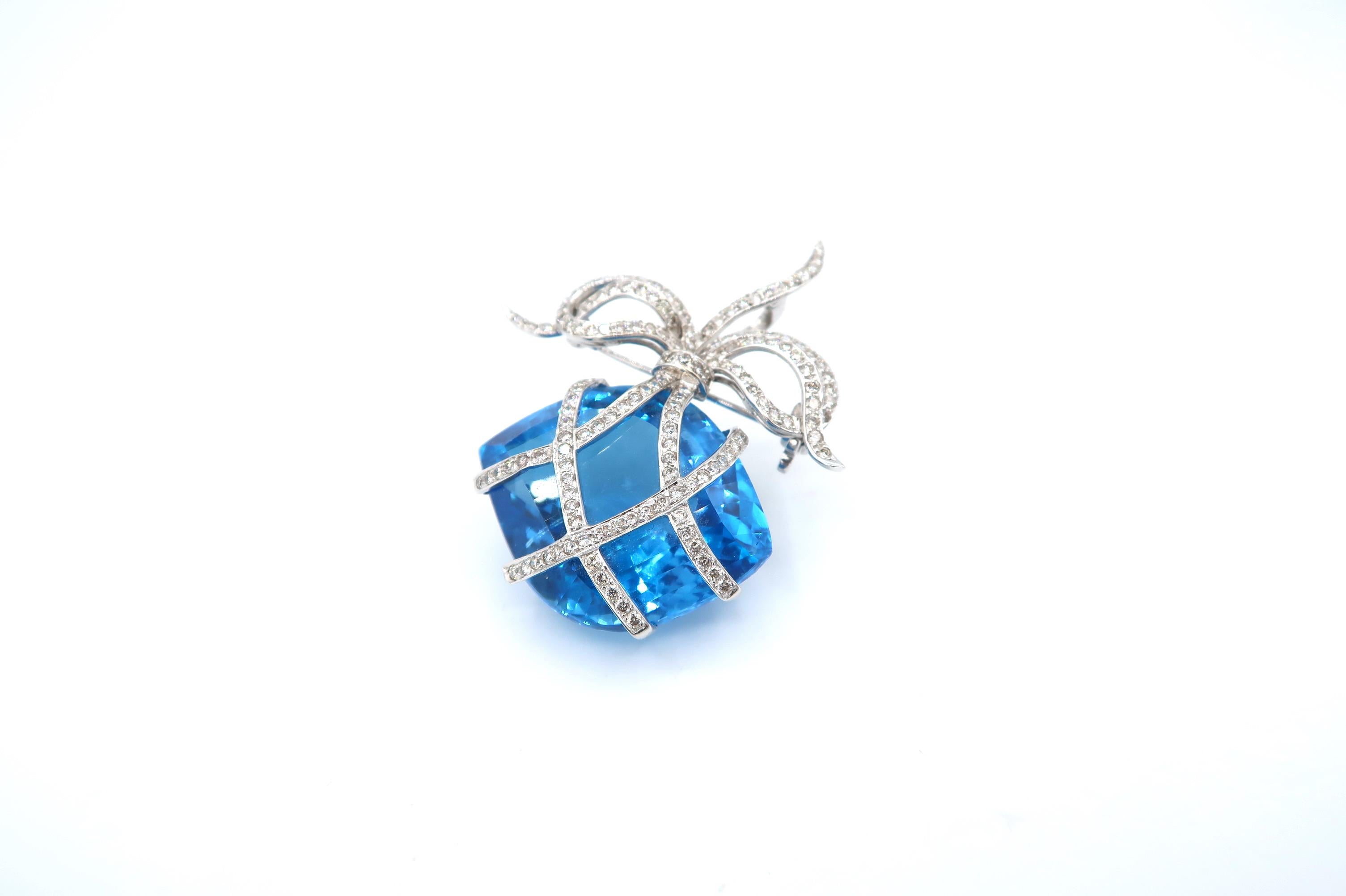 59 Carat Blue Topaz embellished with Diamond Brooch/ Pendant

Blue Topaz: 59cts.
Diamond: 1.81ct.
Gold: 18K 12.22g.