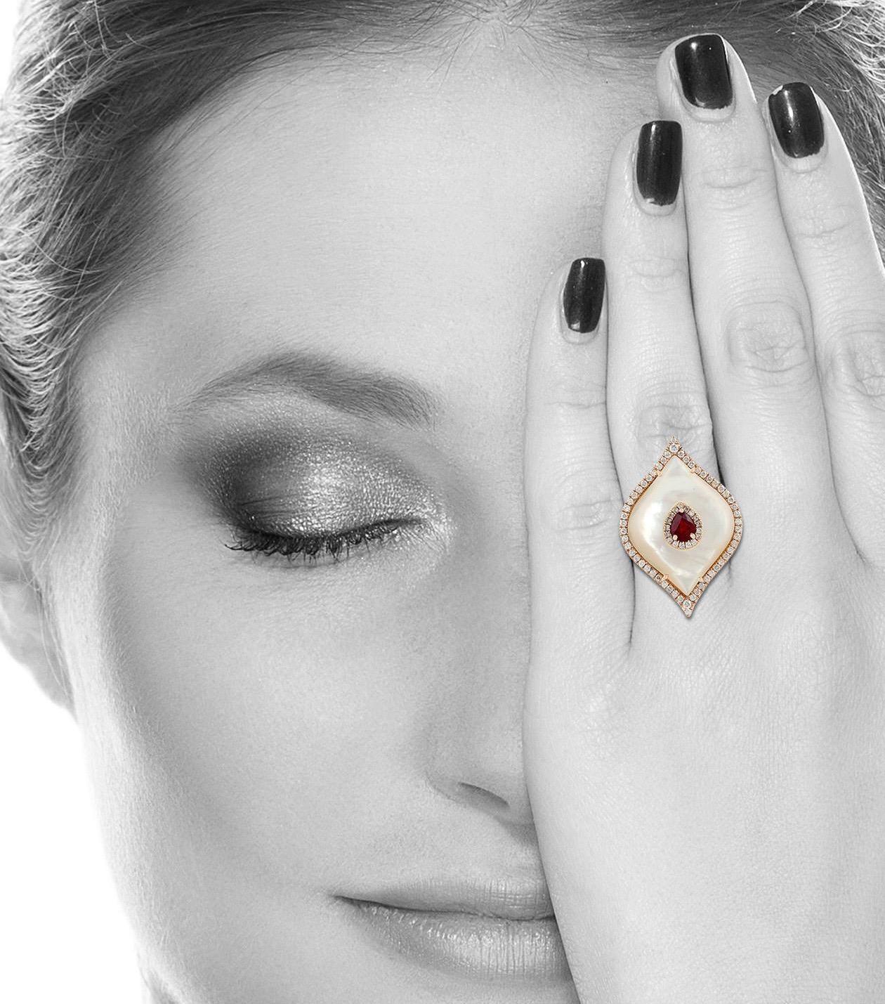 This ring has been meticulously crafted from 18-karat gold. It is hand set in 5.9 carats mother of pearl, 0.5 carat ruby and .89 carats of sparkling diamonds.

The ring is a size 7 and may be resized to larger or smaller upon request. 
FOLLOW 