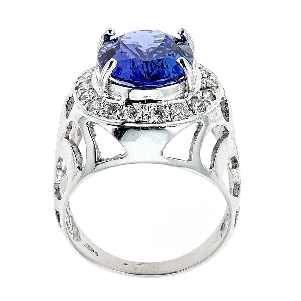 6.5 Carat Tanzanite Solitaire Ring Diamond Pave 14 Karat White Gold Jewelry Size 7.5

Looking for something modern, yet unique and stylish?  this oval cut tanzanite in soft blue color, accented with a halo frame of round shimmering diamonds is just