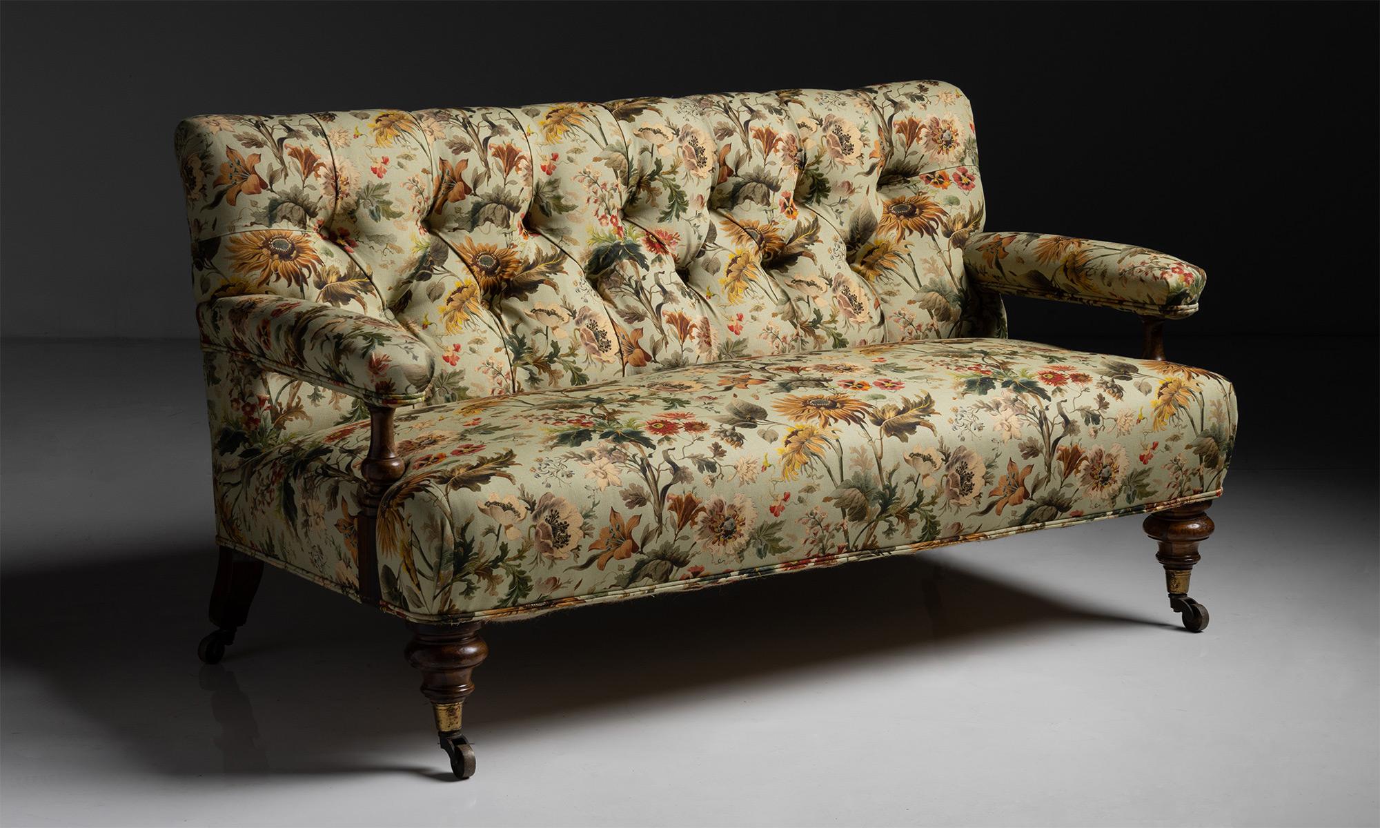 59 Inch long button back sofa in linen blend by House of Hackney

England, circa 1880.

Open arm button back sofa recently upholstered in floral linen and cotton blend by House of Hackney

Measures: 59”L x 32”D x 32.5”H x 18”seat.