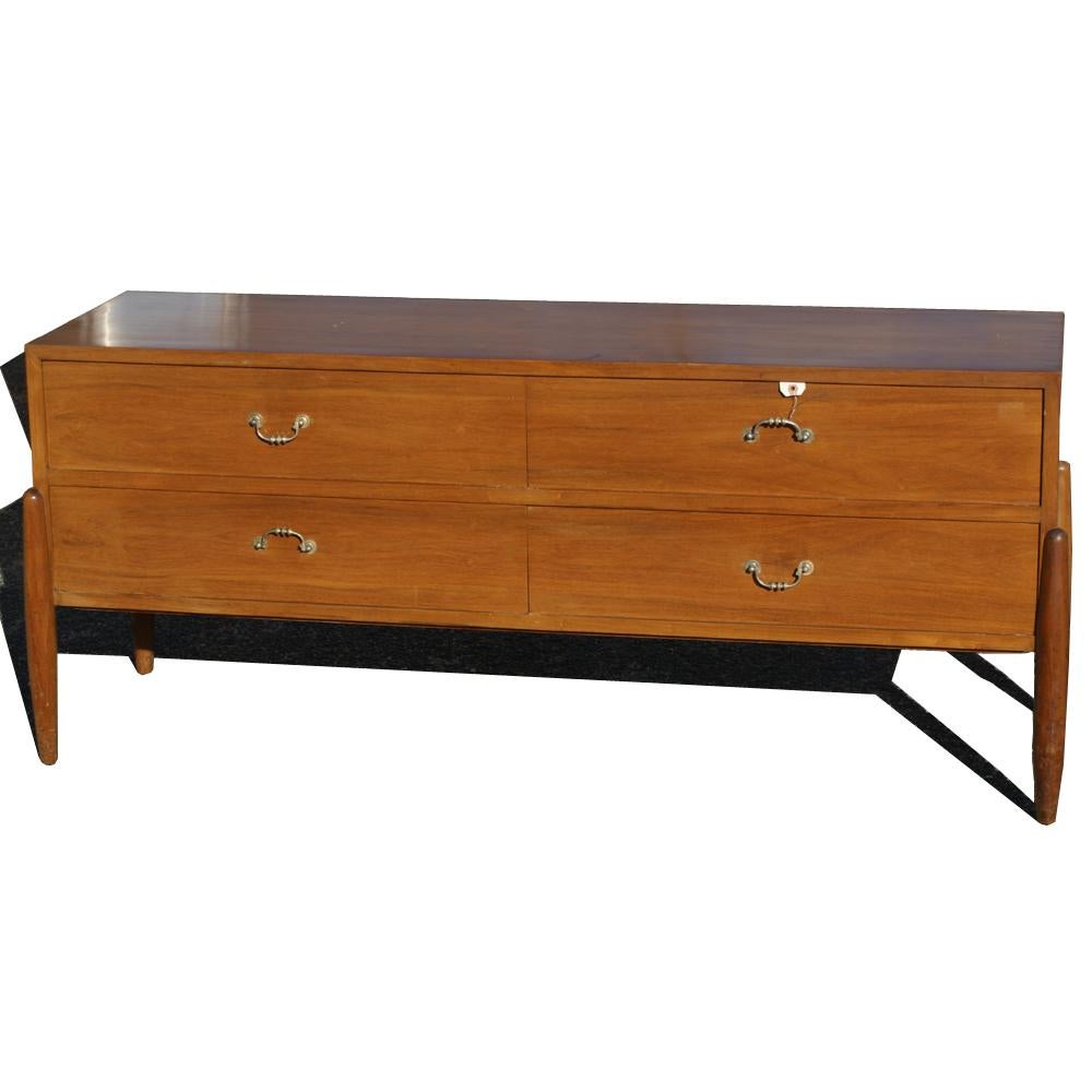Mid-Century Modern Danish walnut cabinet 
Four drawer configuration 
Tapered wood legs.
    