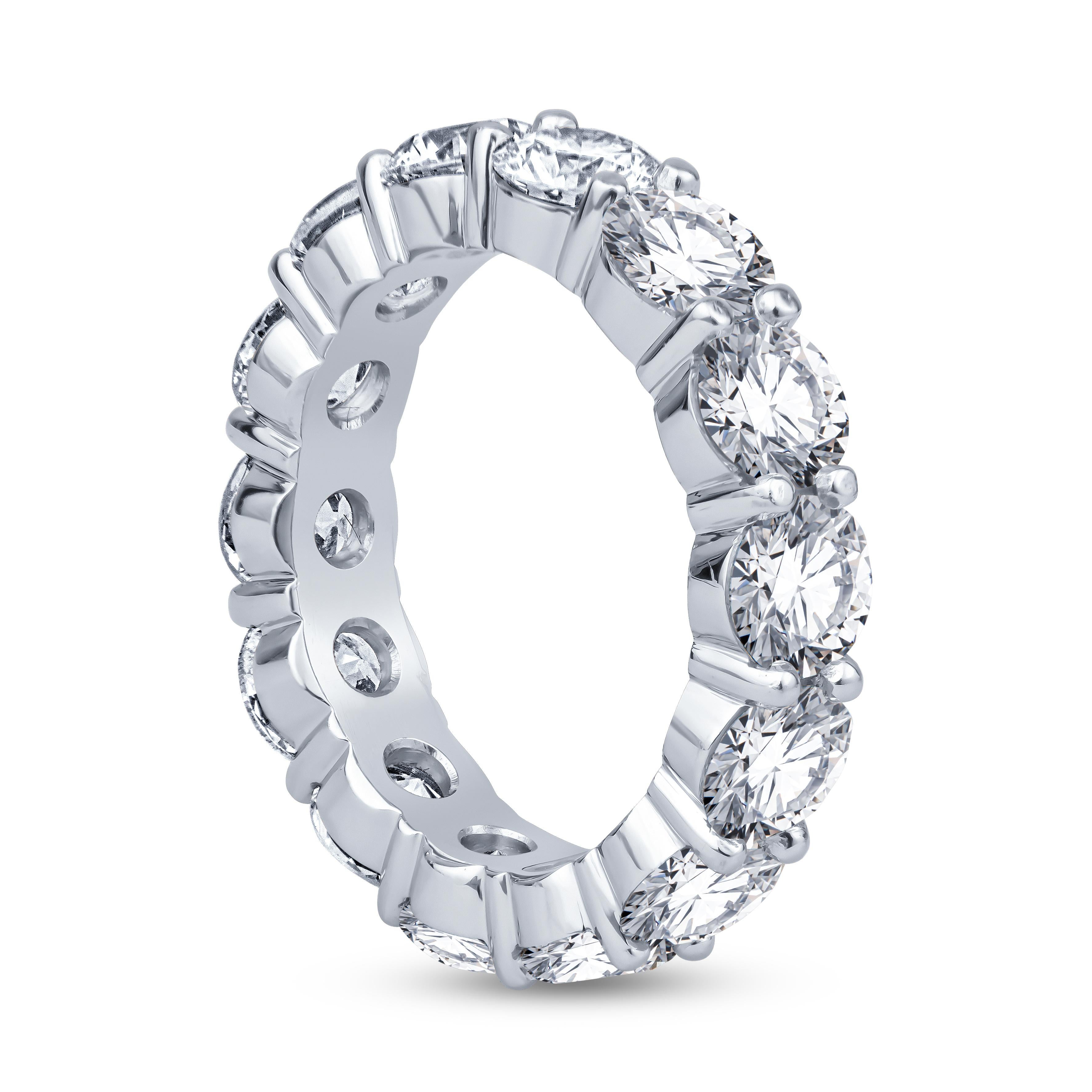 This stunning eternity band features 5.90ct total weight in round brilliant cut, H VS quality diamonds set in a platinum, low profile, shared prong setting. The ring itself is a size 6, and perfect for stacking/layering or wear on its own. Contact