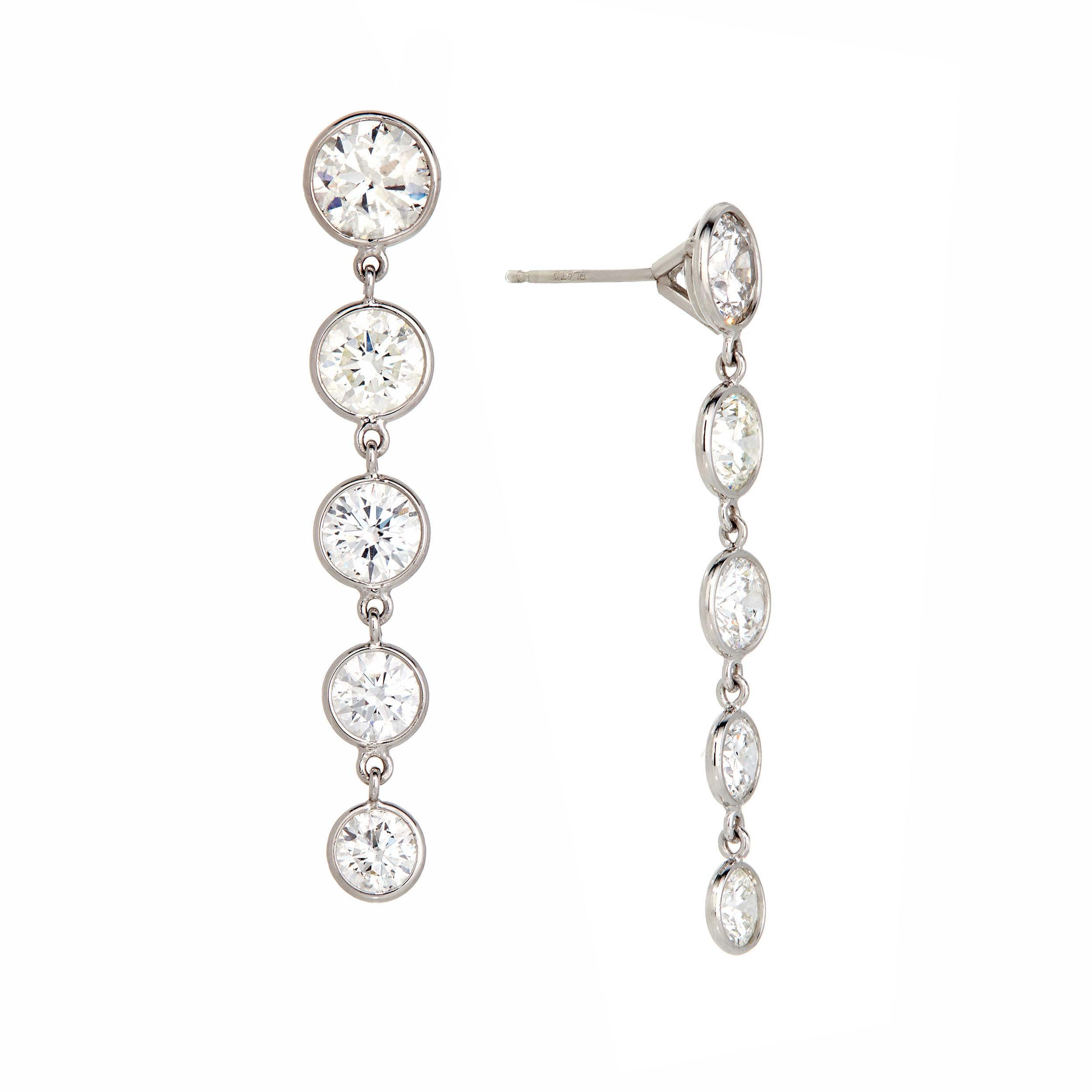 Gorgeous and striking!  With movement between each diamond, these earrings flow effortlessly and delight with every wear, day to night.  Light as a feather on the ear.

Earring Details:

(10) Diamonds
     VS - SI Clarity
     E - F Color

Diamond