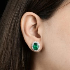 5.91 Ct Oval Zambian Emerald 1.2 Ct SI/H Diamond Stud Earrings 18k White Gold