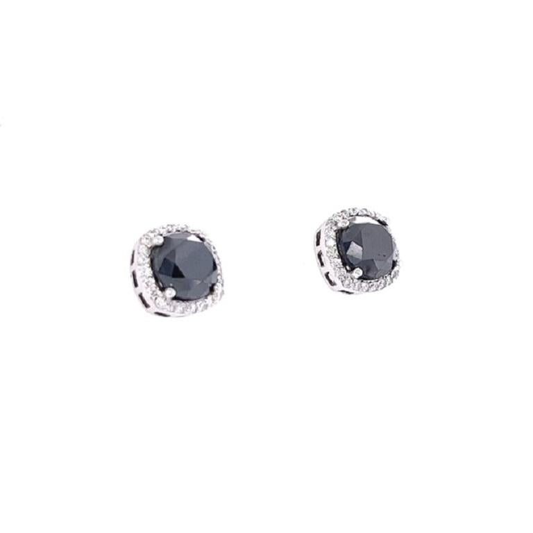 These unique stud earrings have 2 Black Round Cut Diamonds that weigh 5.42 Carats and 48 Round Cut Diamonds that weigh 0.50 Carats. (Clarity: VS, Color: H) The total carat weight of the earrings are 5.92 Carats. The black diamonds measure at