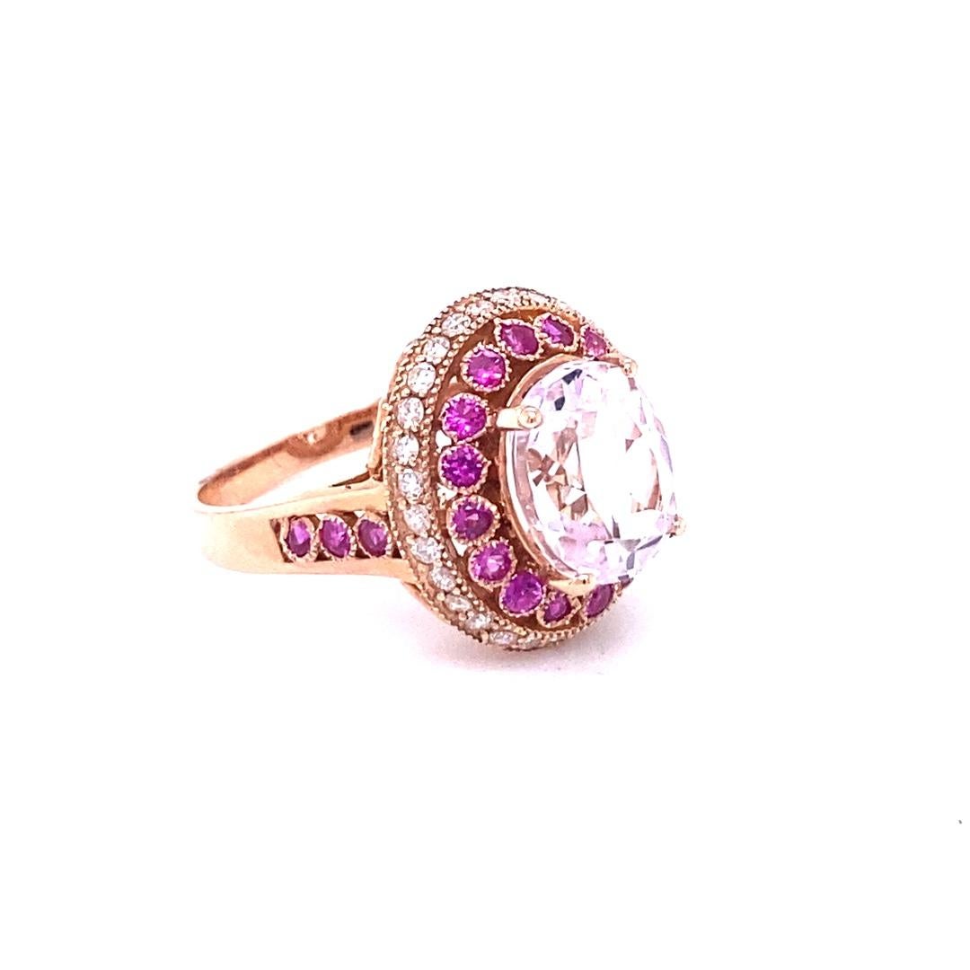 5.92 Carat Kunzite Pink Sapphire Diamond 14 Karat Rose Gold Ring!

This beautiful ring has an Oval Cut 4.53 Carat Kunzite that is set in the center of the ring and is surrounded by 22 Round Cut Pink Sapphires that weigh 0.93 Carats. Additionally