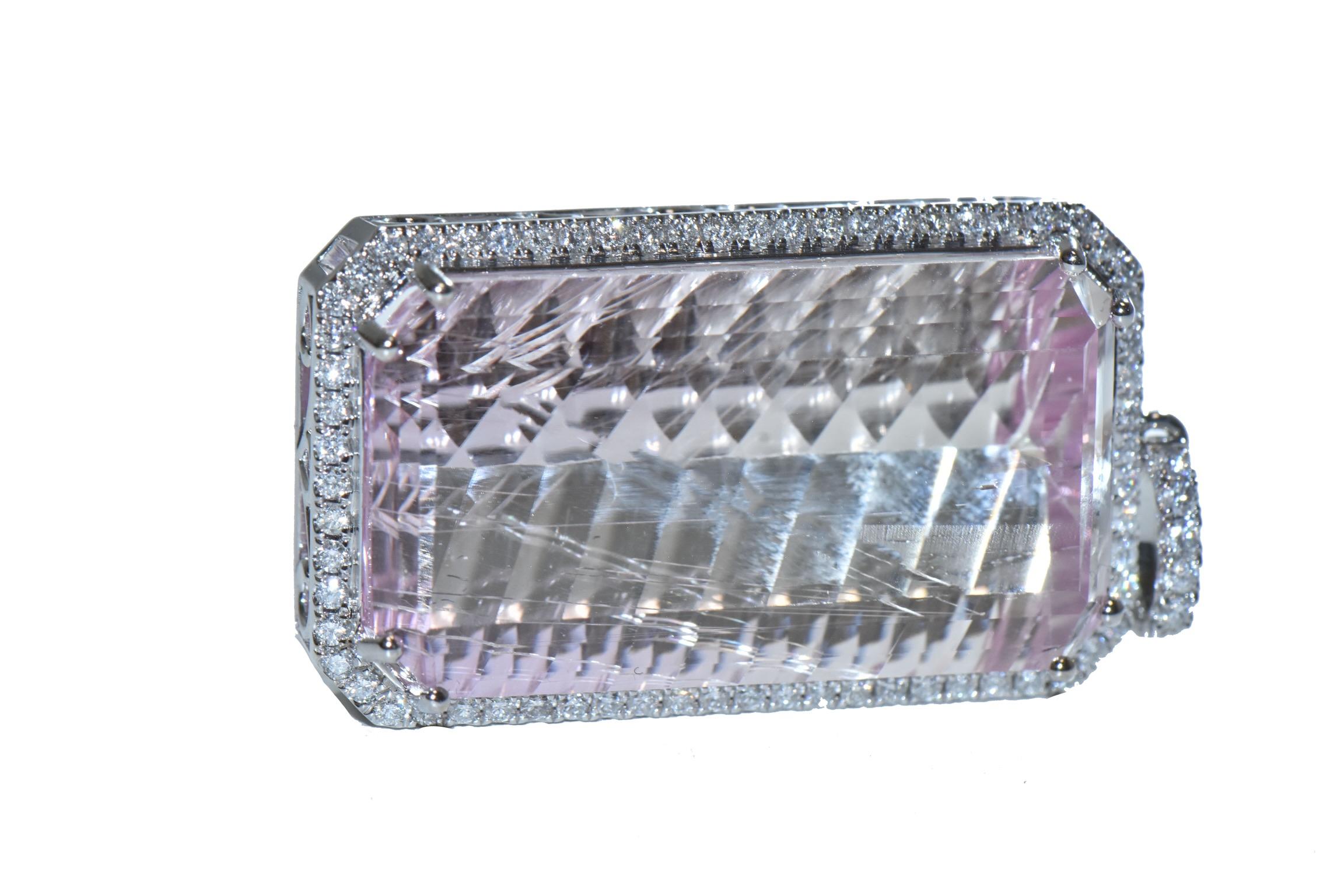 59.29 Carat Emerald Cut Kunzite Pendant with a beautiful Diamond Halo

Historically, kunzite was mainly used for ornamental purposes. Its exquisite color and transparency made it a sought-after gemstone for jewelry, especially during the Art Nouveau