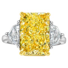 5.92ct Fancy Light Yellow Diamond Elongated Radiant Diamond Three Stone Ring