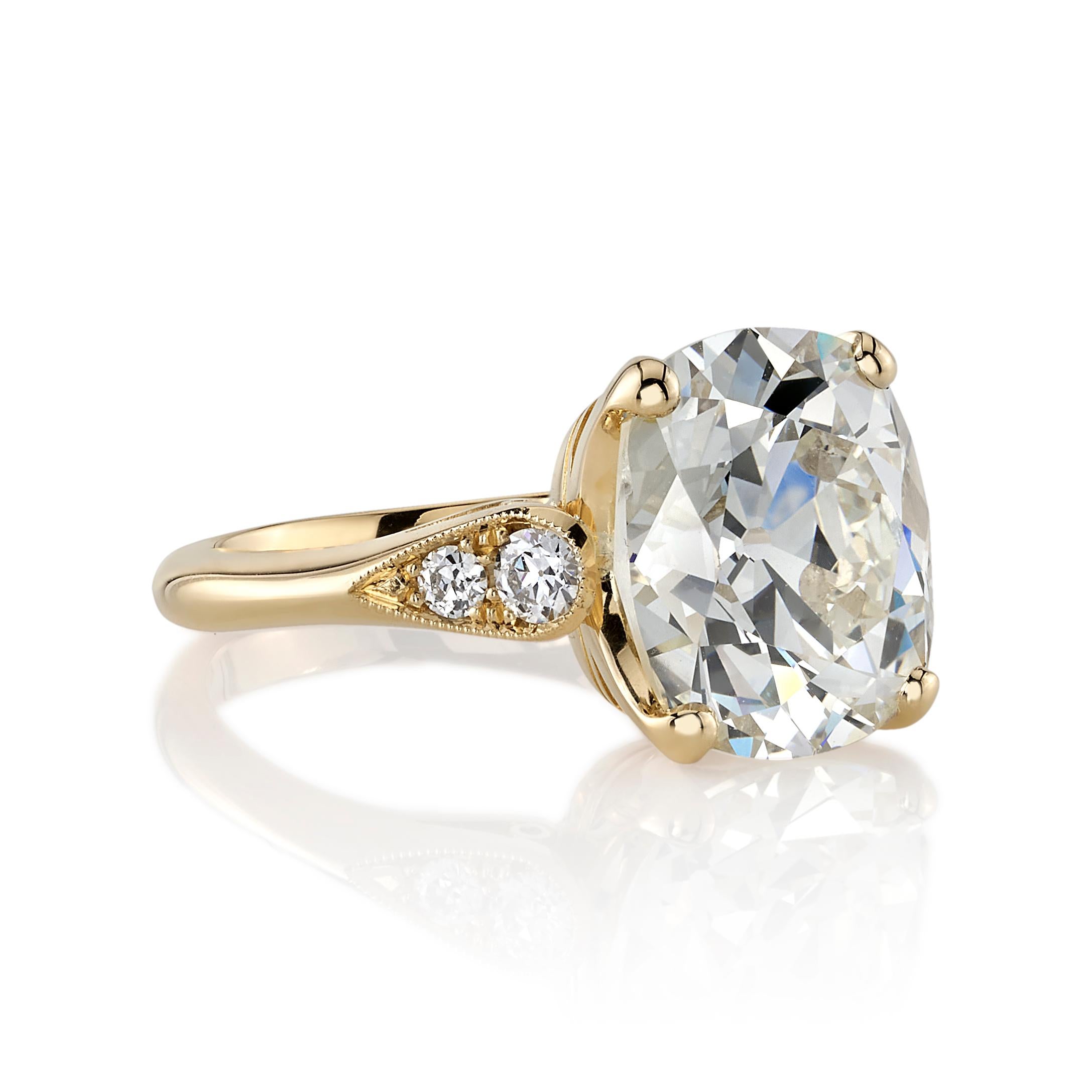 5.93ct O-P/SI1 GIA certified antique Cushion cut diamond with 0.19ctw old European cut accent diamonds set in a handcrafted 18K yellow gold mounting.

Ring is currently a size 6 and can be sized to fit. 