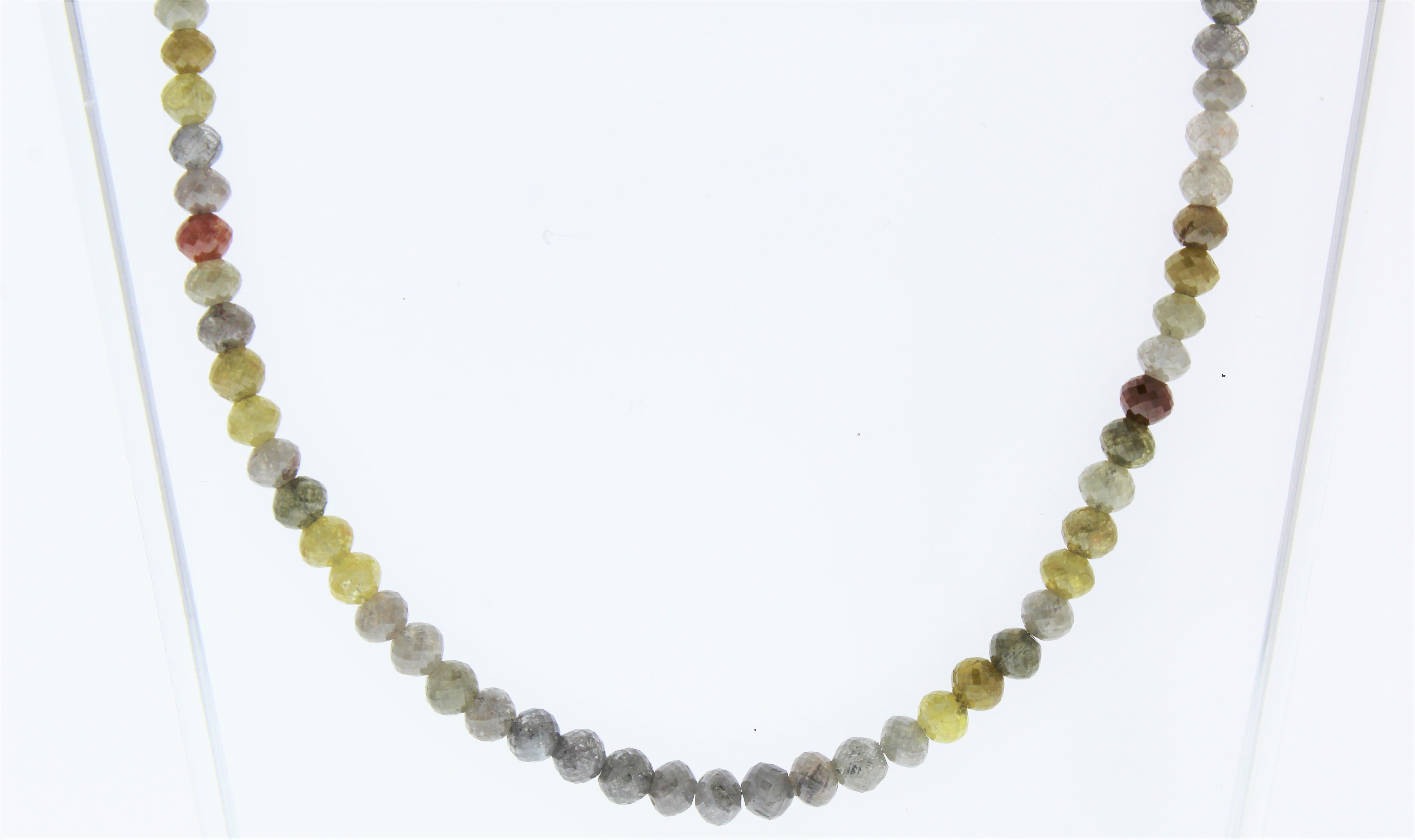 This necklace is a dramatic strand of 131 multi color round faceted bead diamonds totaling 59.30 carats. Slim in design and perfect for layering alongside other necklaces and chains, this multi color diamond necklace is sure to get noticed.