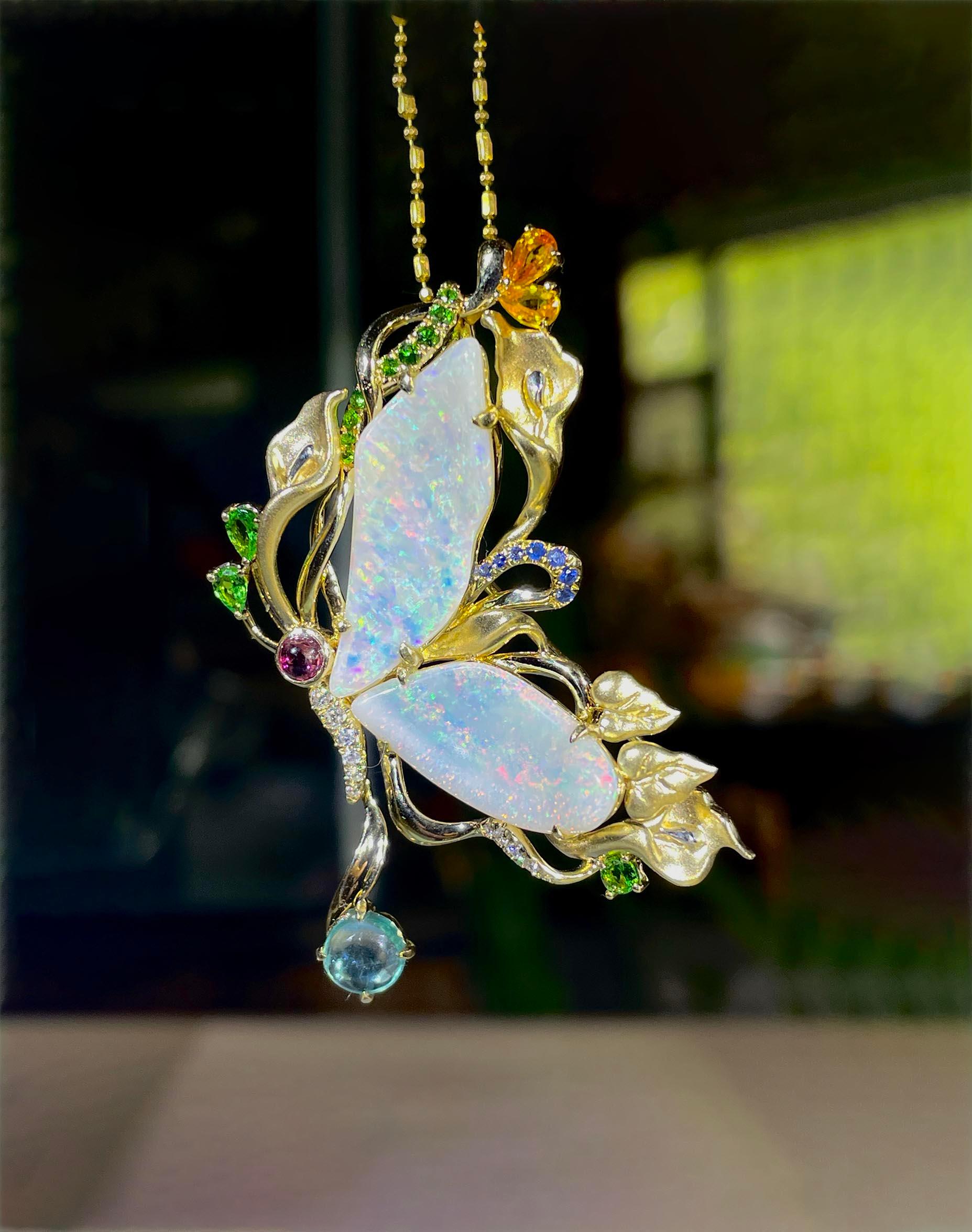   Adorn yourself with this exquisite one-of-a-kind Solid Australian Opal Butterfly Pendant / Brooch crafted in 14K Gold. The intricate design and exquisite craftsmanship create a unique and artistic interpretation of a butterfly in flight leveraging