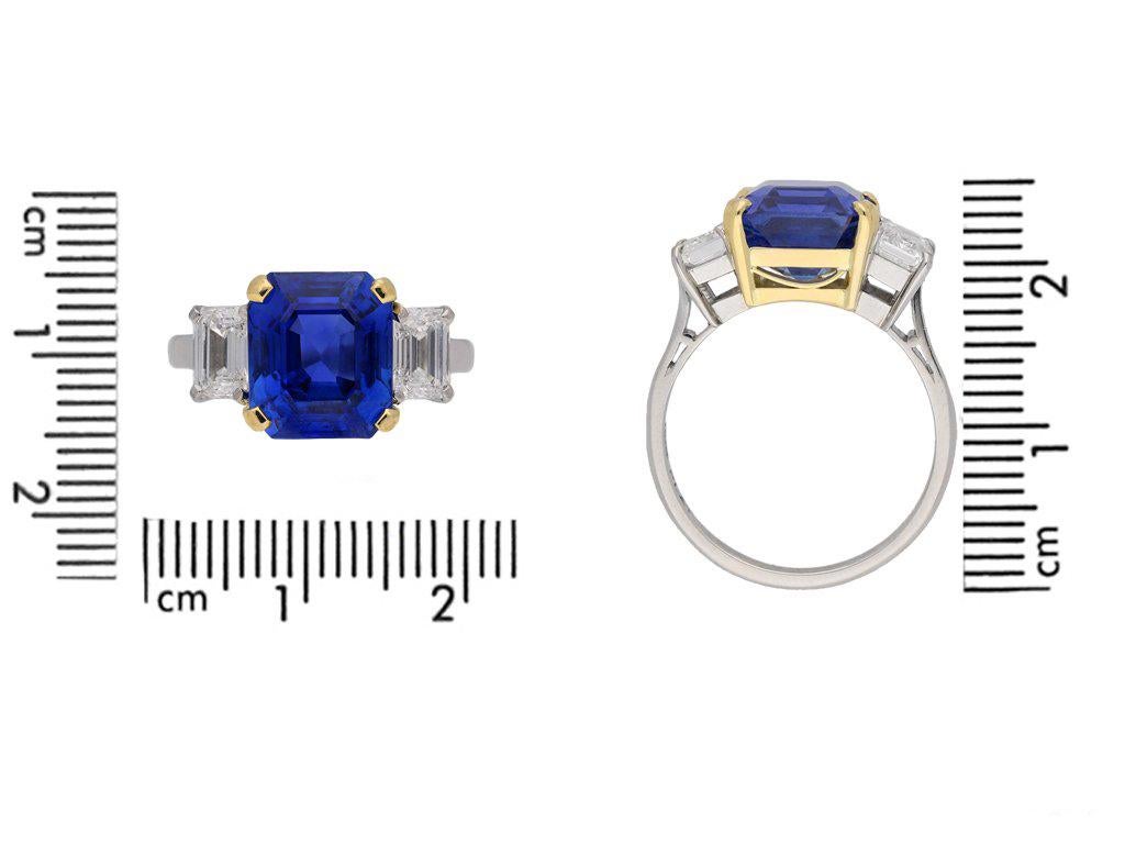 Vintage Burmese sapphire and diamond ring. Centrally set with an octagonal emerald-cut natural unenhanced Burmese sapphire in an open back four claw setting with an approximate weight of 5.94 carats, additionally set with an octagonal emerald-cut