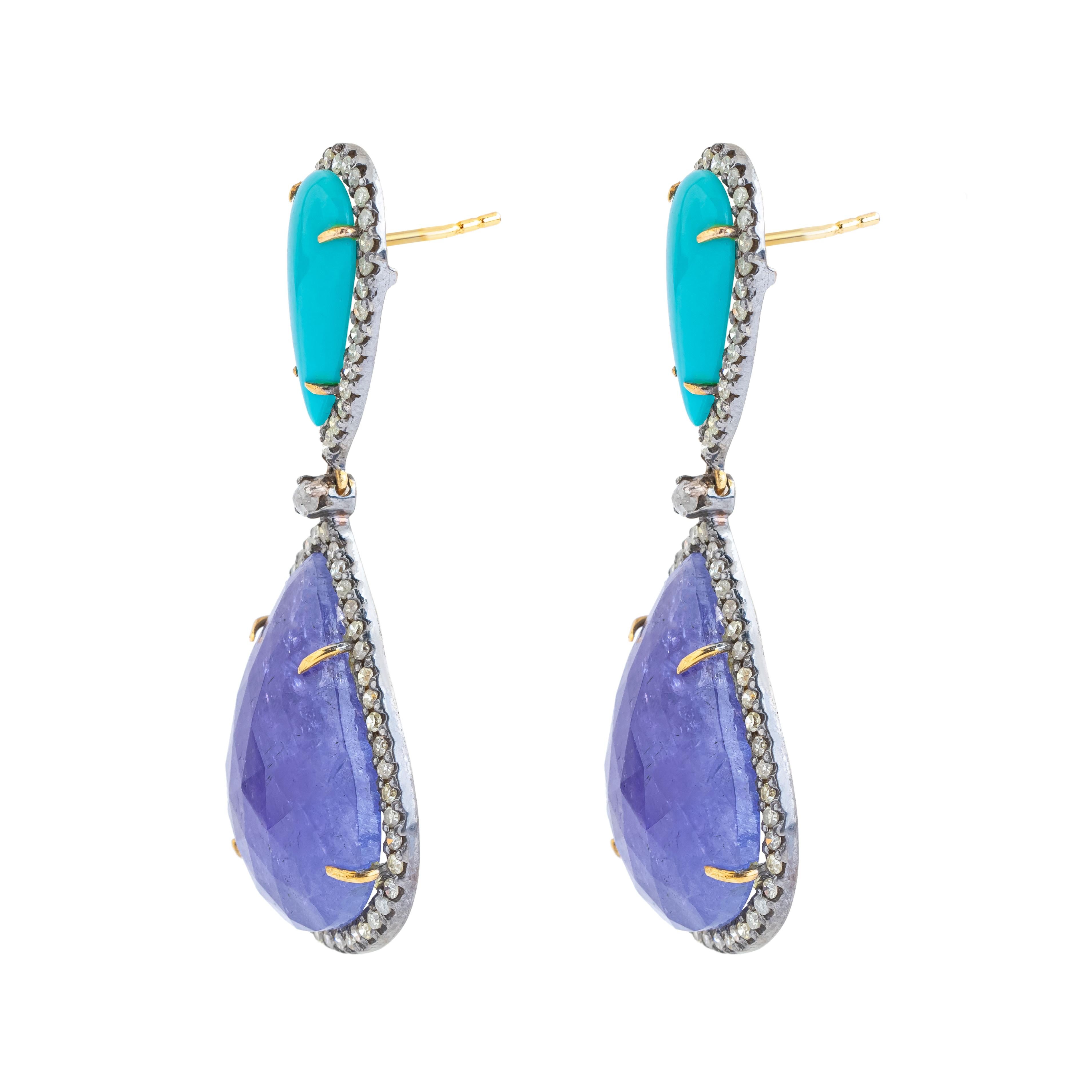 Discover unparalleled elegance with our exquisite 59.5 Carat Diamond, Tanzanite, and Turquoise Drop Earrings. Each piece is meticulously crafted and uniquely curated to offer a harmonious blend of luxury and artistry. These drop earrings capture the