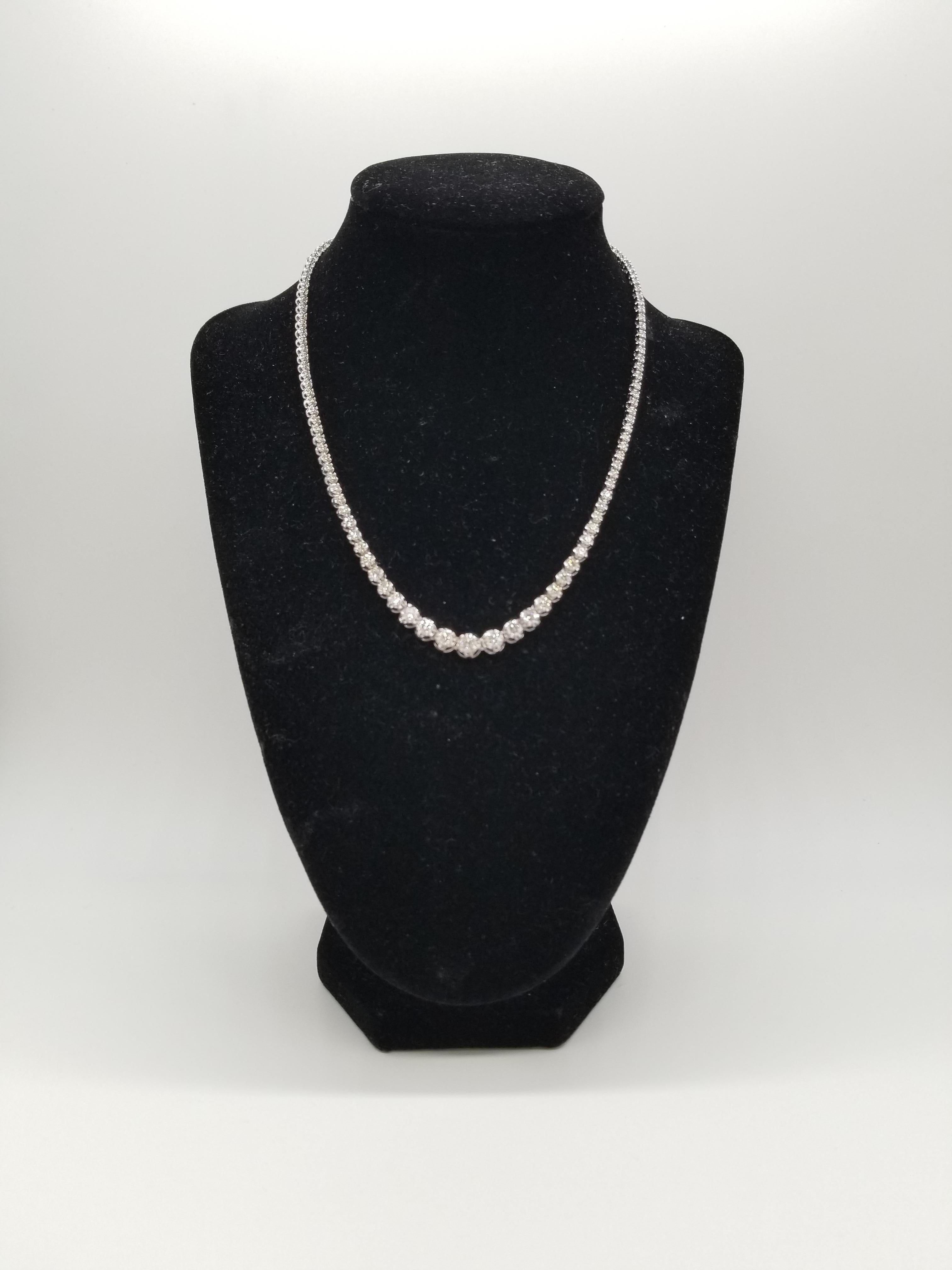 Stunning 14 Karat White Gold Round Brilliant Cut Diamond Tennis Necklace set on 4- prong buttercup setting. The total diamond weight is 5.95 carats. The closure is an insert clasp with safety clasp. Length is 16 inches. center stone 0.35 ct. Very