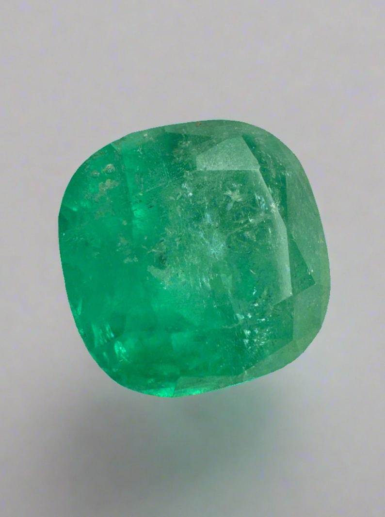 Stone: Emerald
Weight: 5.95-carats
Shape: Cushion Cut
Clarity: Semi-Transparent
Luster: Good
Color: Medium Green
Measurements: 10.58mm x 10.63mm x 8.48mm
Geographic Origin: Colombia
Treatment: Natural, Oiling

Comments: Due to their growth