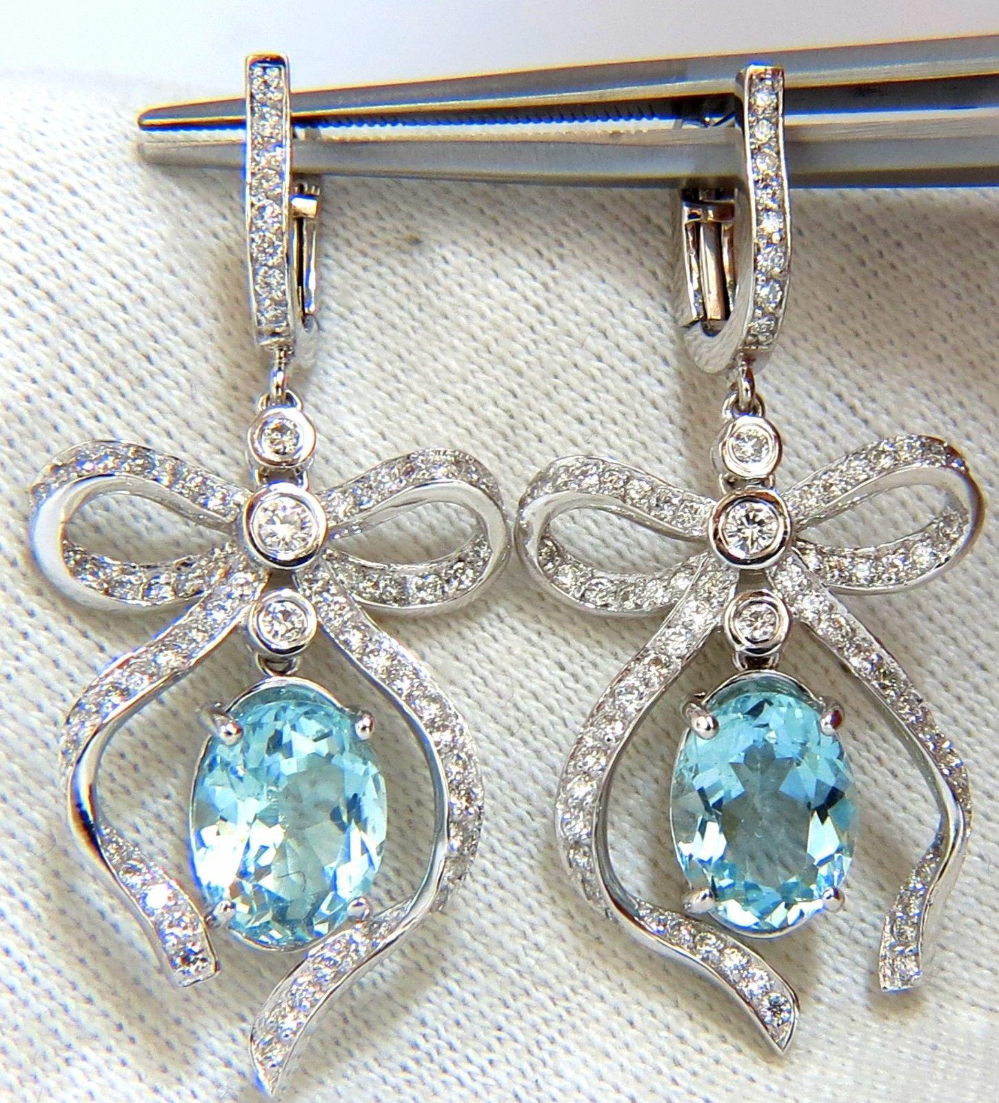 4.69ct. Natural Aquamarines & 1.26ct. Diamond dangle earrings.

Aquamarines: Oval cut, transparent & clean clarity.

Fully faceted & gorgeous vivid aqua colors

Range: 9.8 X 8mm each.



1.26cts of round diamonds: 

G-color, Vs-2 clarity.

14kt.