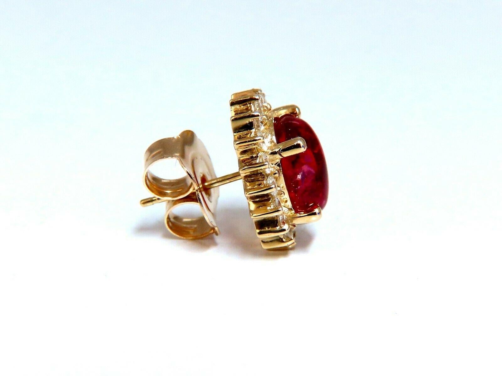 Spinel Cocktail Halo Earrings

5.00ct. Natural Raspberry Red Spinels

Cabochon Cut, Clean clarity and brilliant cut

Excellent transparency

9 x 7mm 

.95ct. Round diamonds

G-color, Vs-2 clarity

14kt. yellow gold

6.7 grams

Earrings overall: