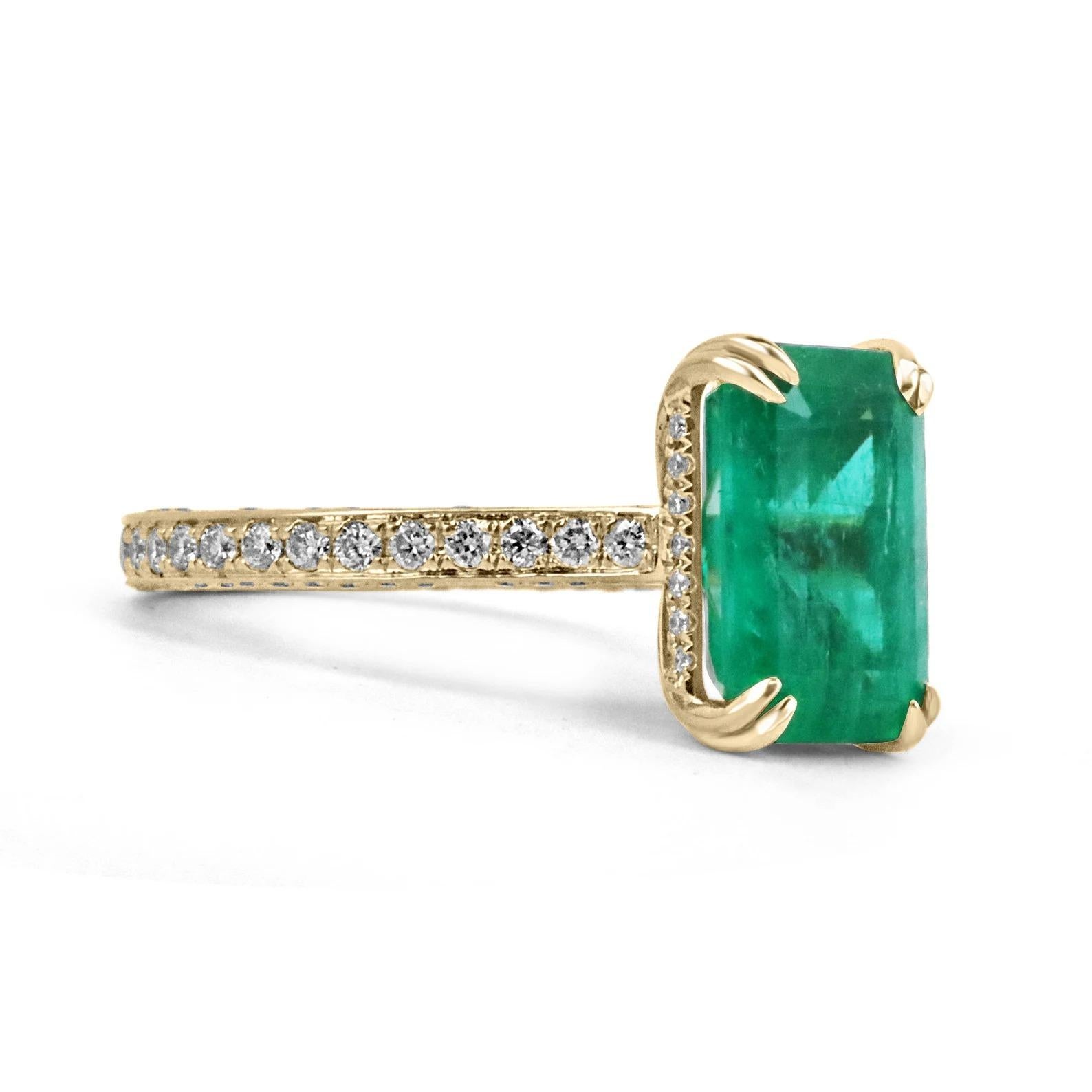 Elegantly displayed is a natural, emerald-cut AAA Colombian emerald and diamond shank ring. The center gem is a deep green, natural emerald filled with life, color, and brilliance! Among the emeralds, impressive qualities are its vibrant color and