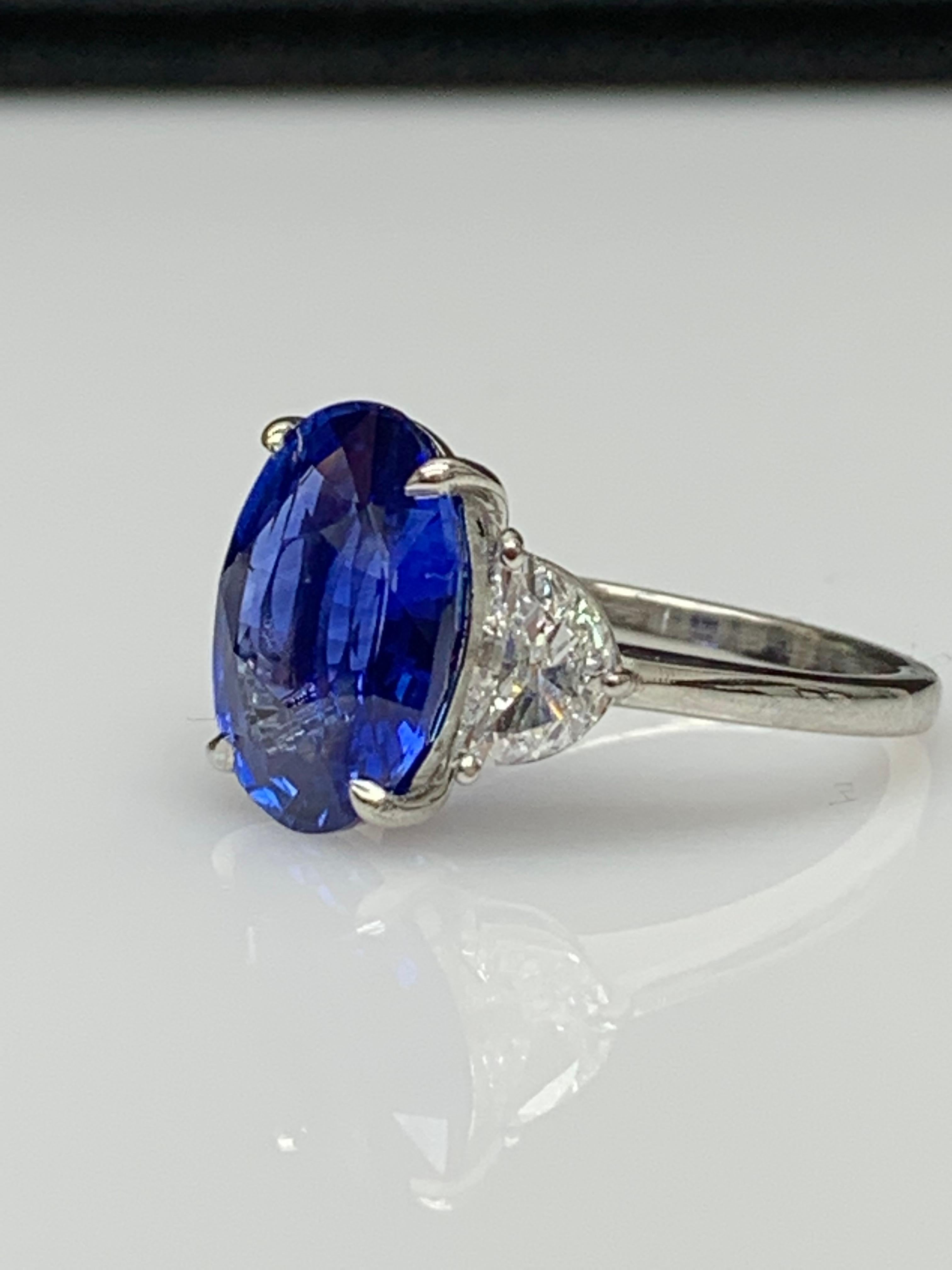 Oval Cut 5.96 Carat Oval Blue Sapphire Diamond Three-Stone Engagement Ring in Platinum For Sale