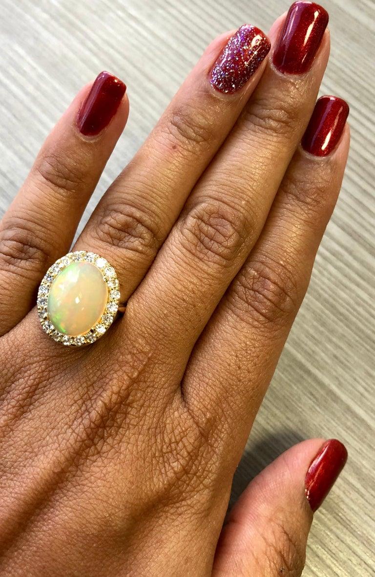 Contemporary 5.96 Carat Oval Cut Opal Diamond Yellow Gold Ring For Sale