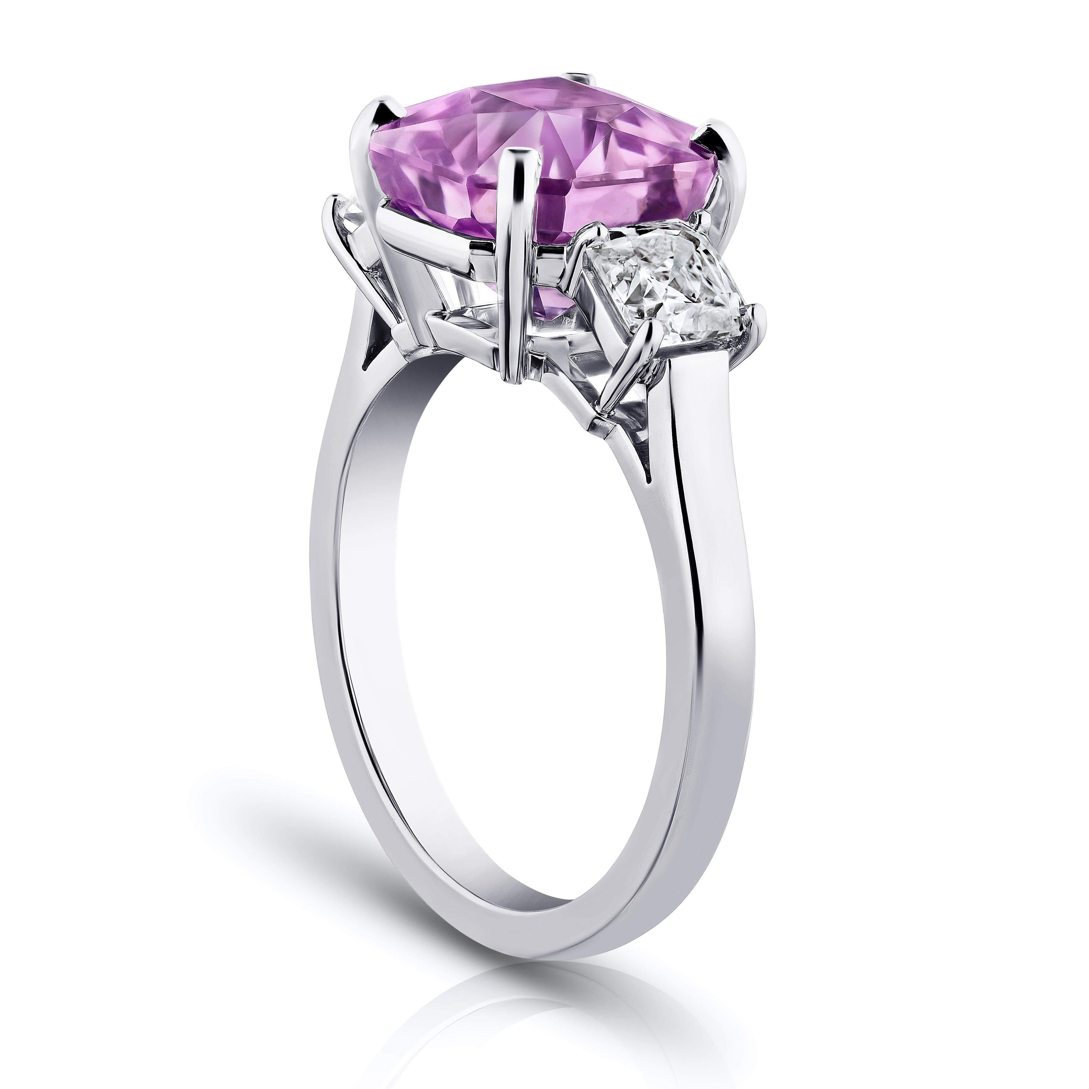 5.96 carat radiant cut pink sapphire with antique square diamonds 1.00 carats set in a platinum Ring. Size 7